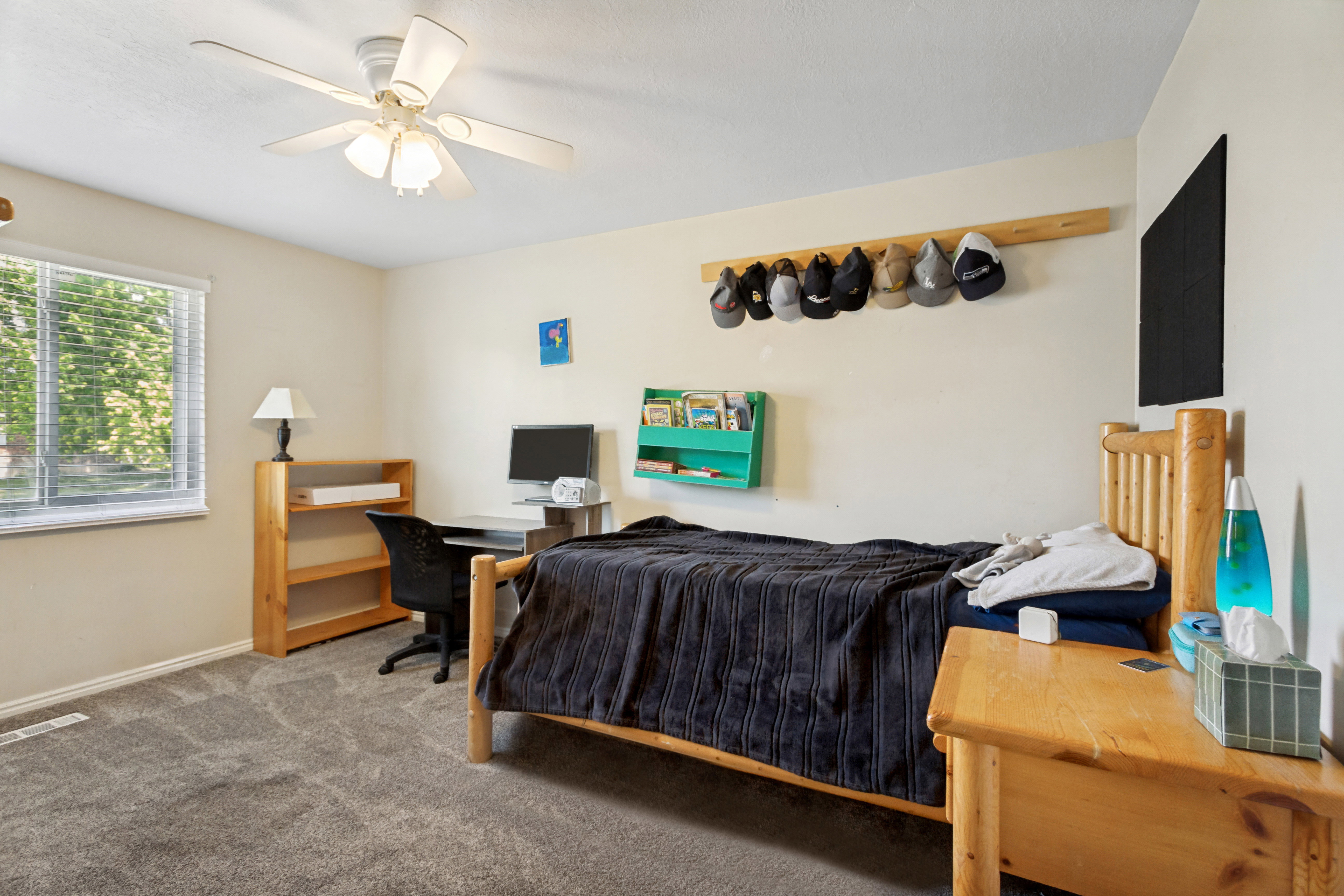 Interior room featuring light-toned walls and grey carpeting