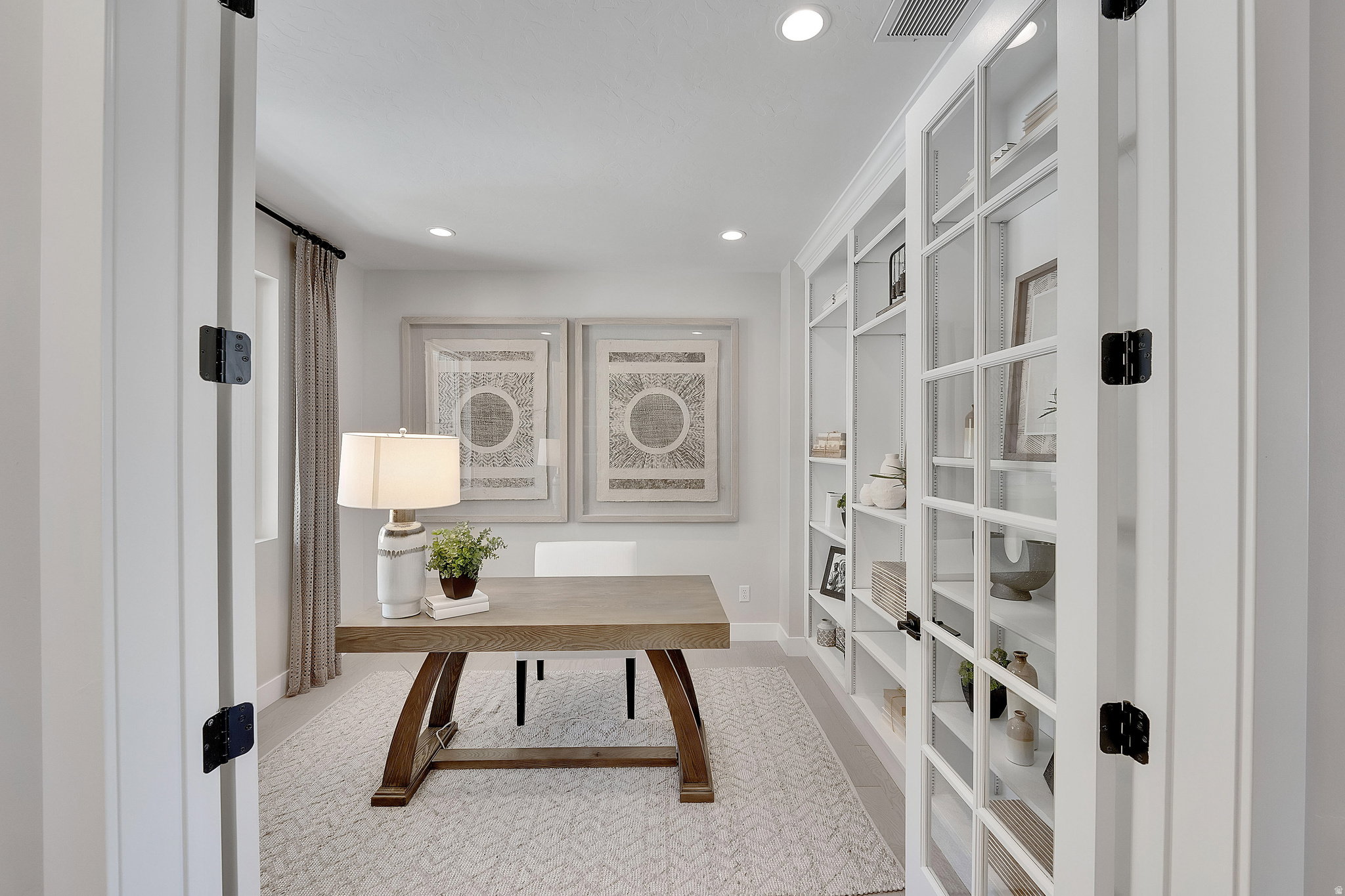 Dedicated room with a window and recessed lighting, featuring a wood-finish desk and carpet flooring. This is not the actual home being built but a representation of the features available in this home. Colors and finishes may differ from those shown.