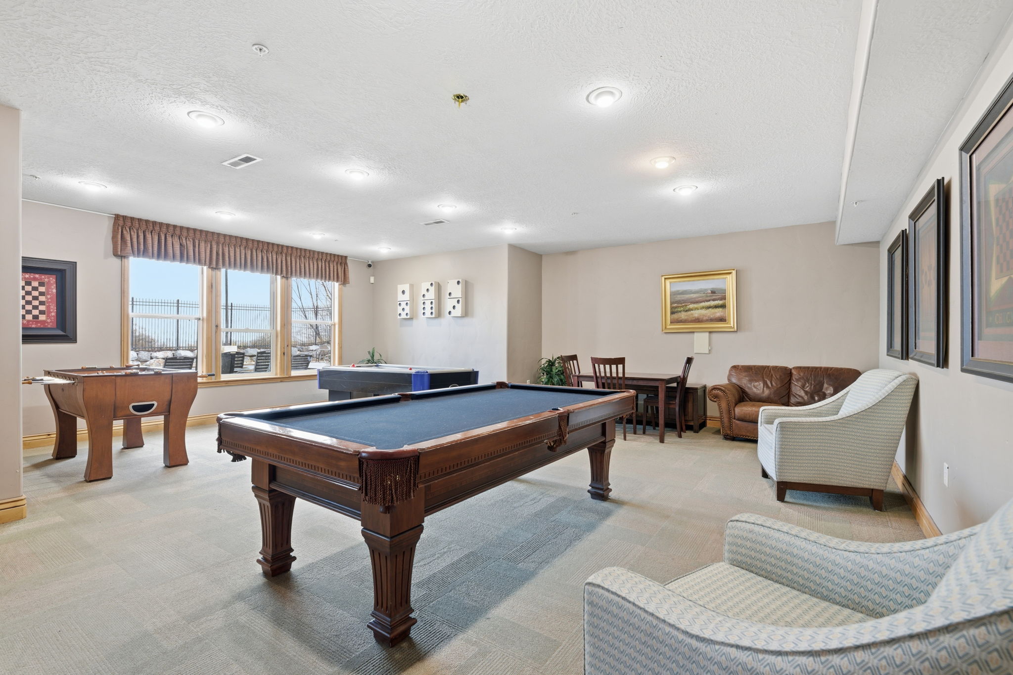 Recreation room featuring a classic billiards table, wall-to-wall carpeting, recessed lighting, and multiple windows