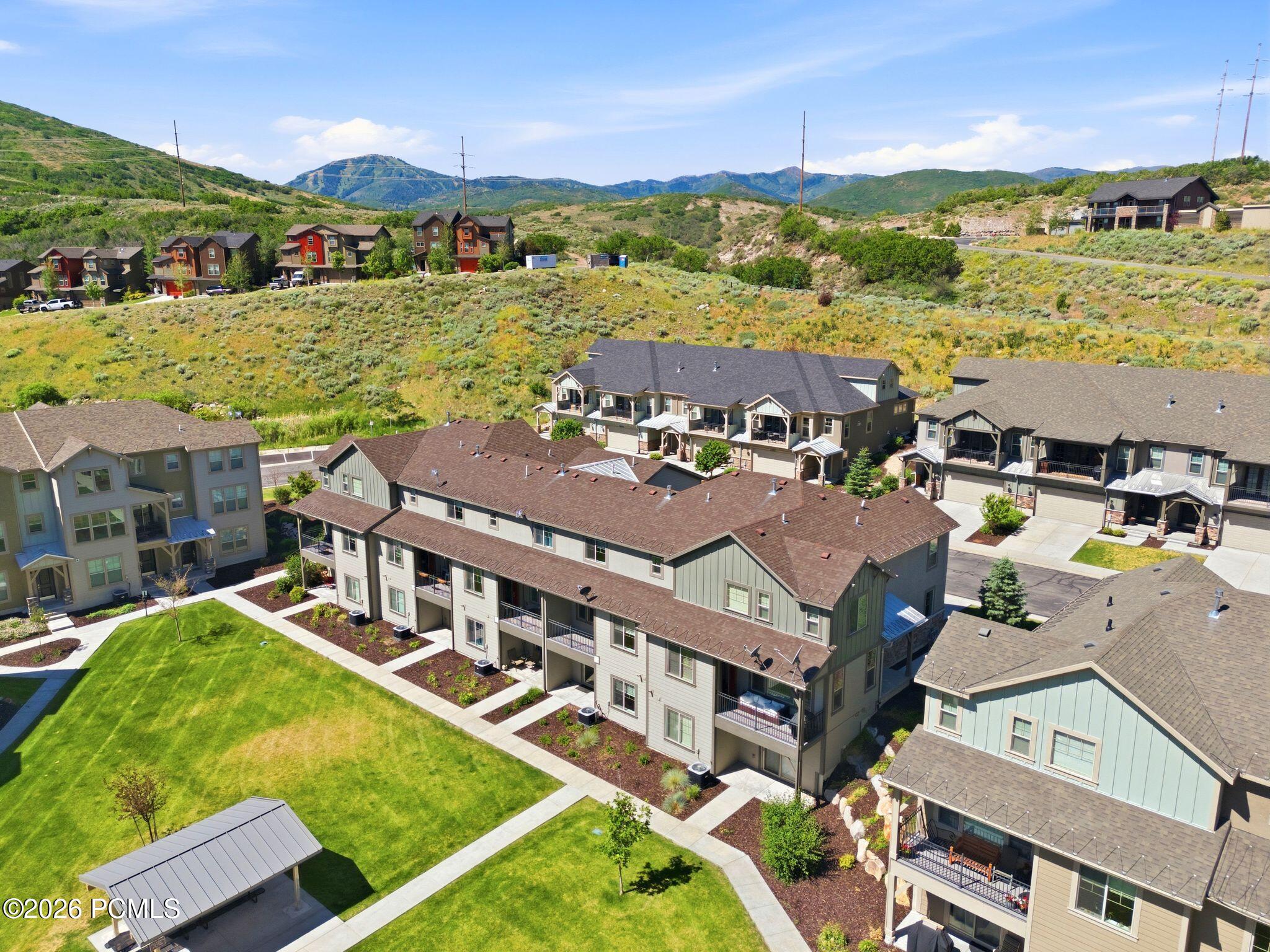 Contemporary multi-story buildings featuring varied siding and rooflines