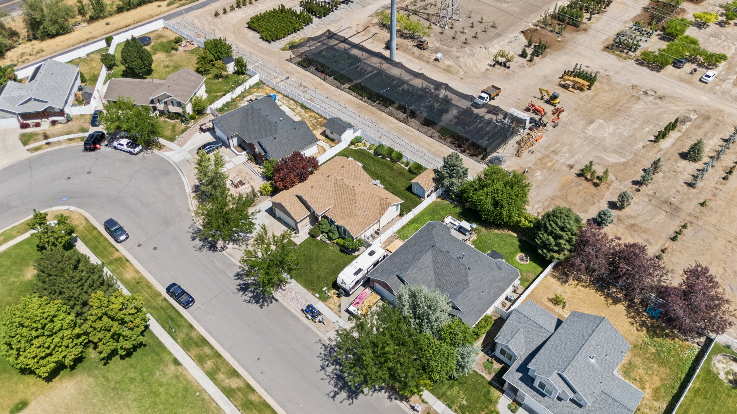 Aerial perspective showcasing a residential neighborhood with varied property designs and mature landscaping