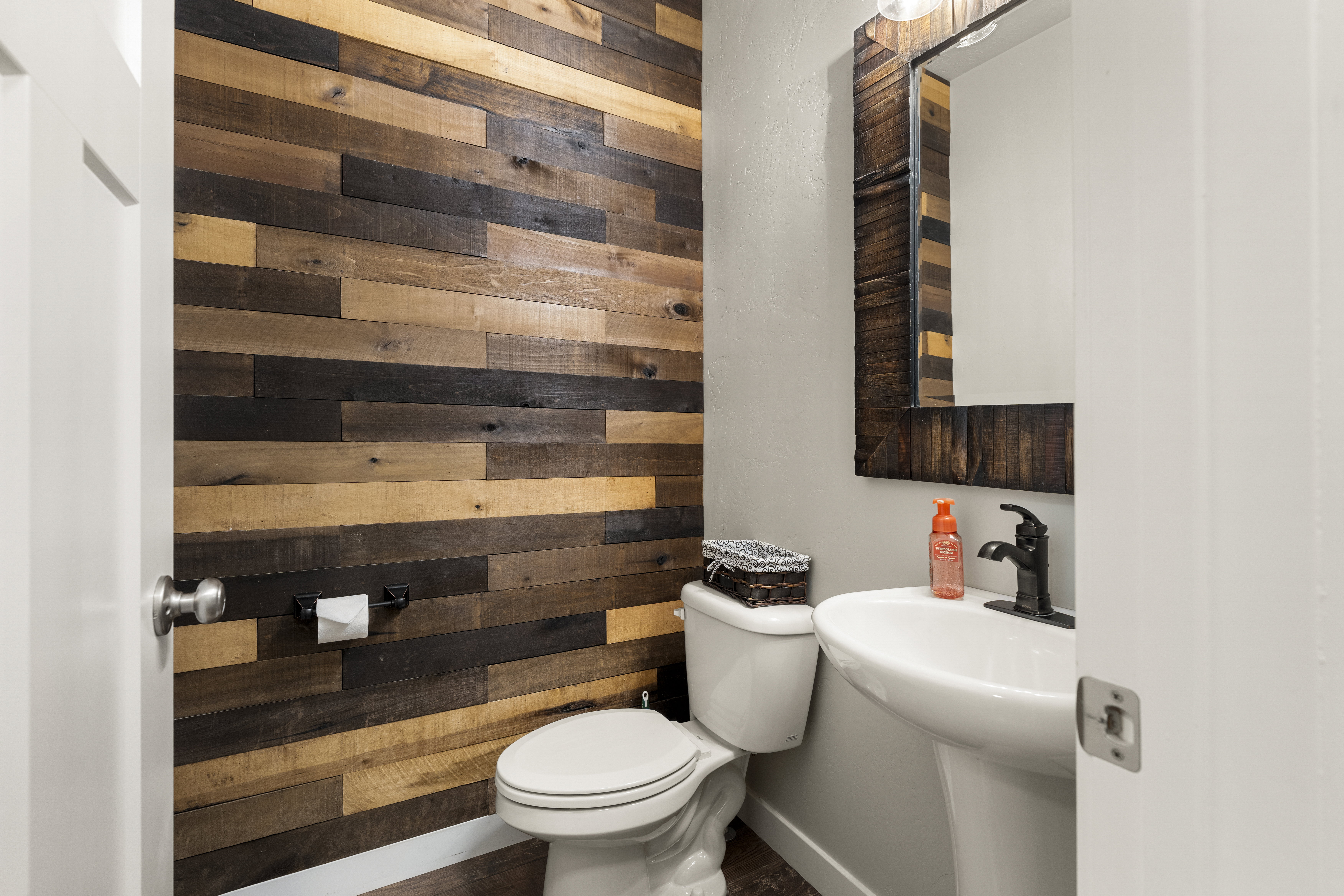 Accent wall featuring varied wood-finish planks