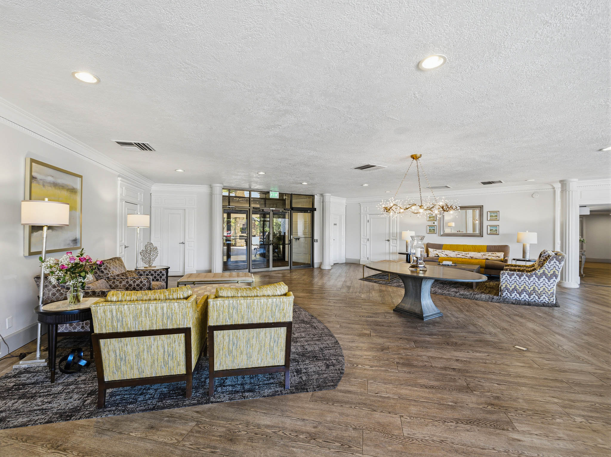 Spacious communal area featuring wood-finish flooring and recessed lighting