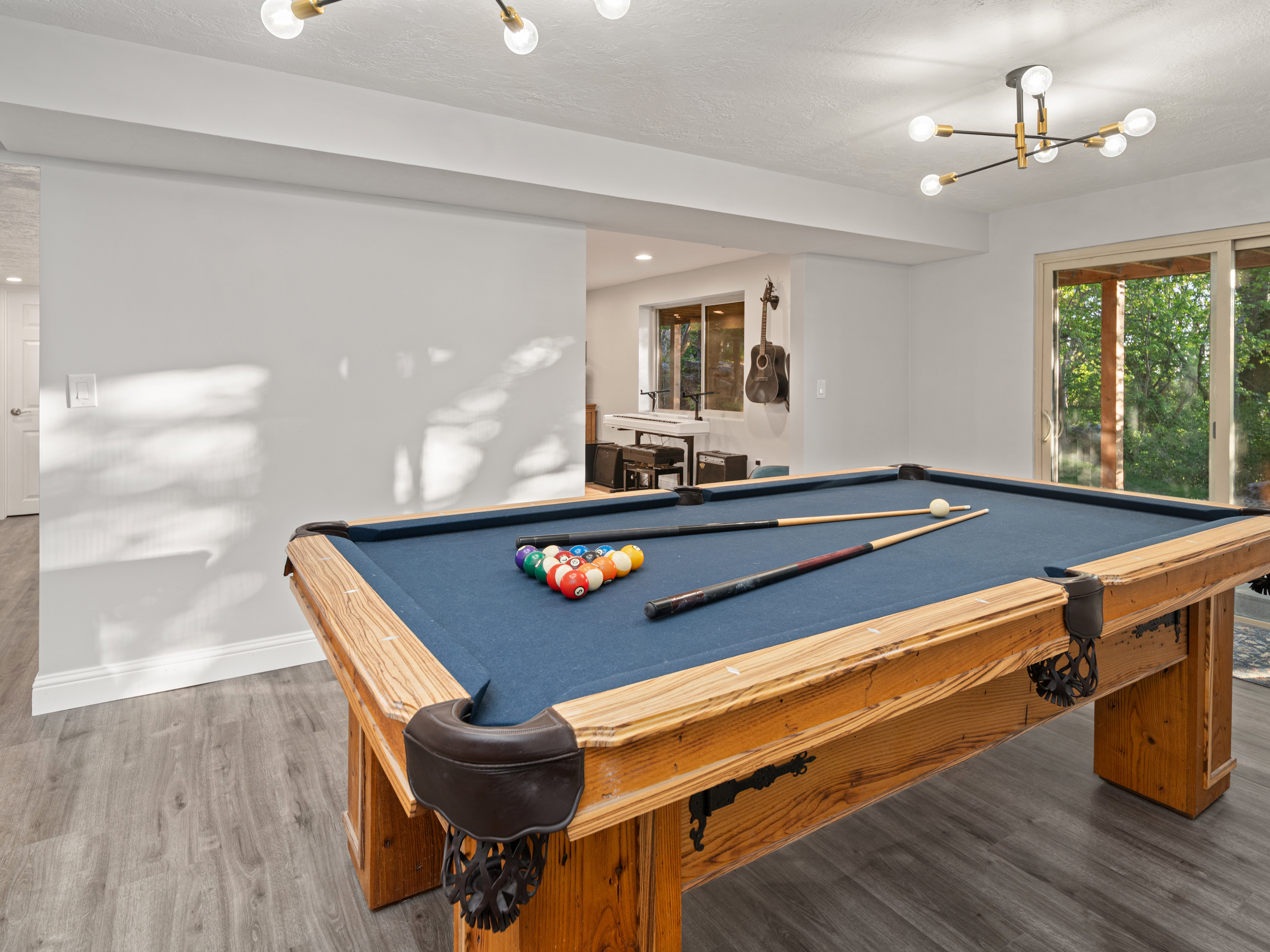 Recreational space featuring a full-size pool table, wood-finish flooring, recessed lighting, and a modern chandelier