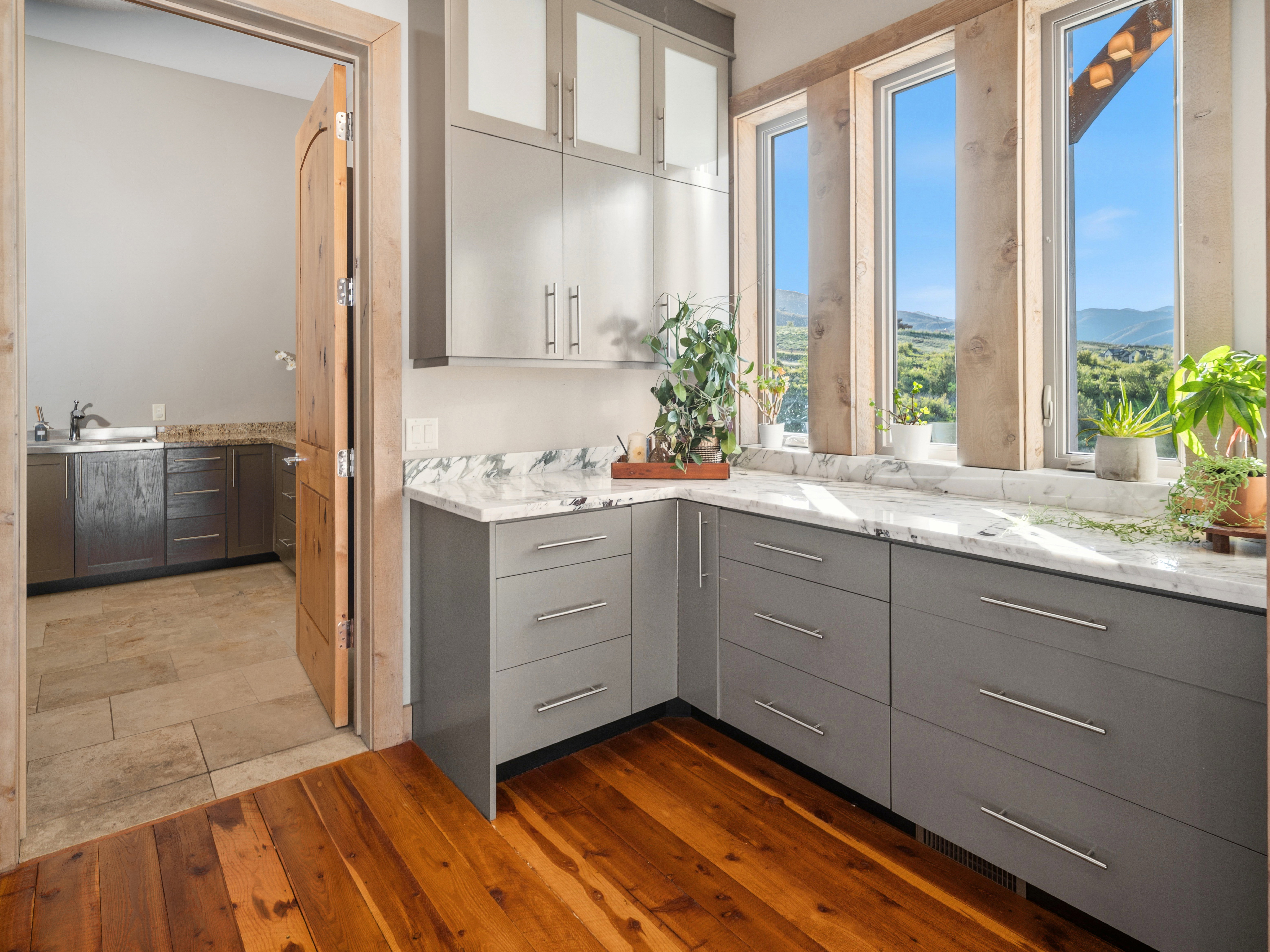 Custom cabinetry with sleek hardware and a light-toned countertop
