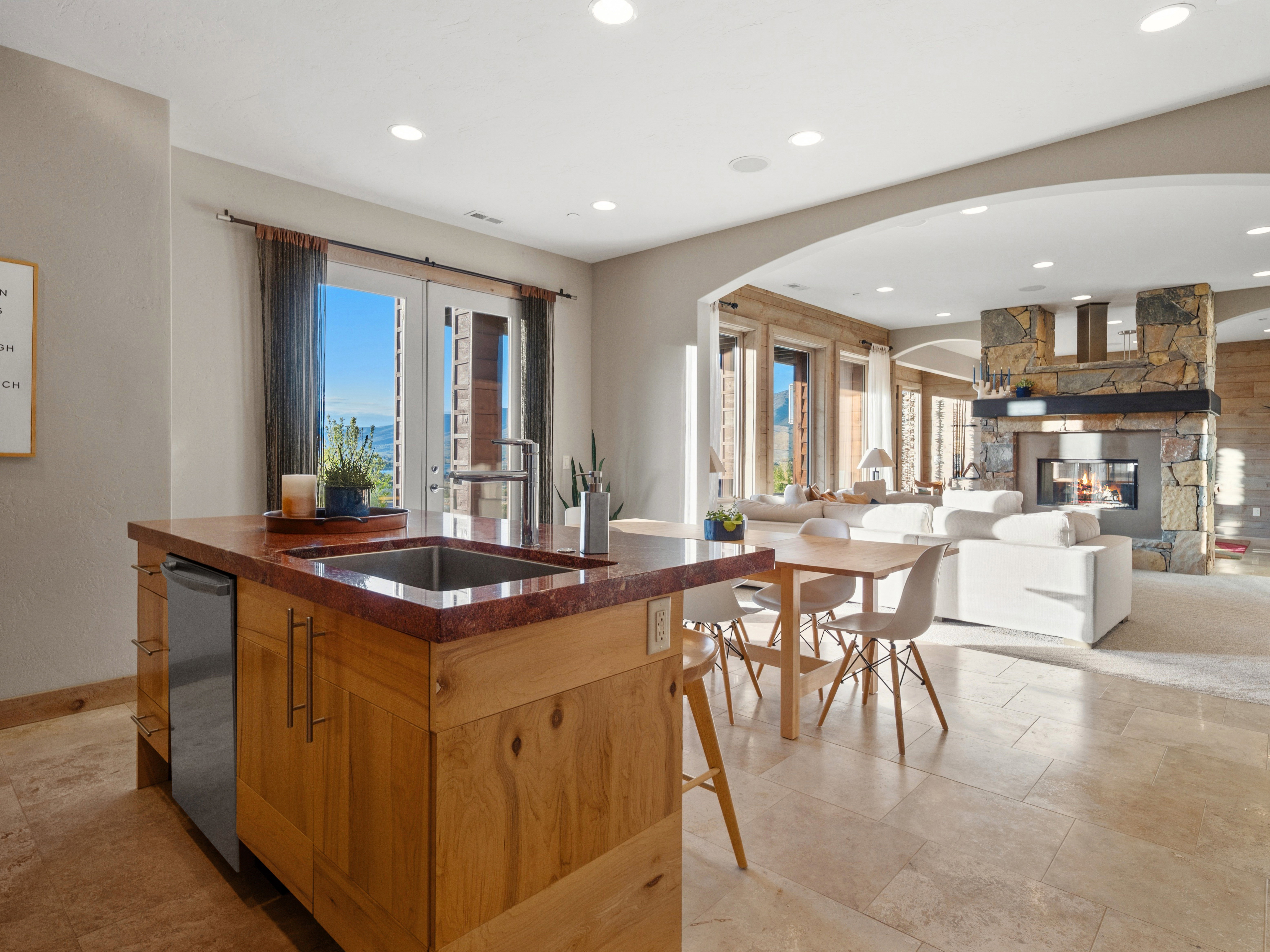Kitchen island with a built-in sink and undercounter appliance