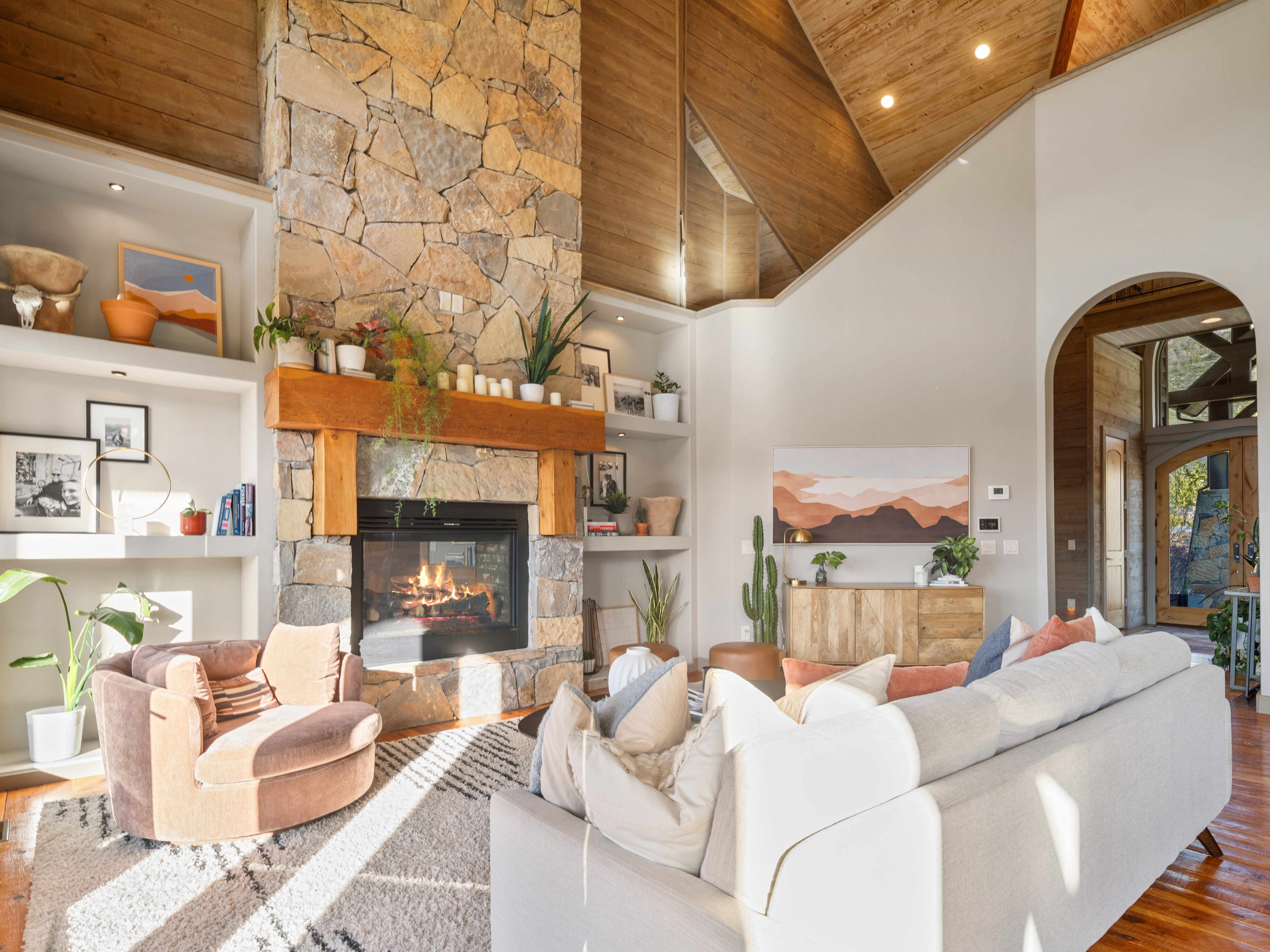 Soaring vaulted wood-paneled ceilings with recessed lighting