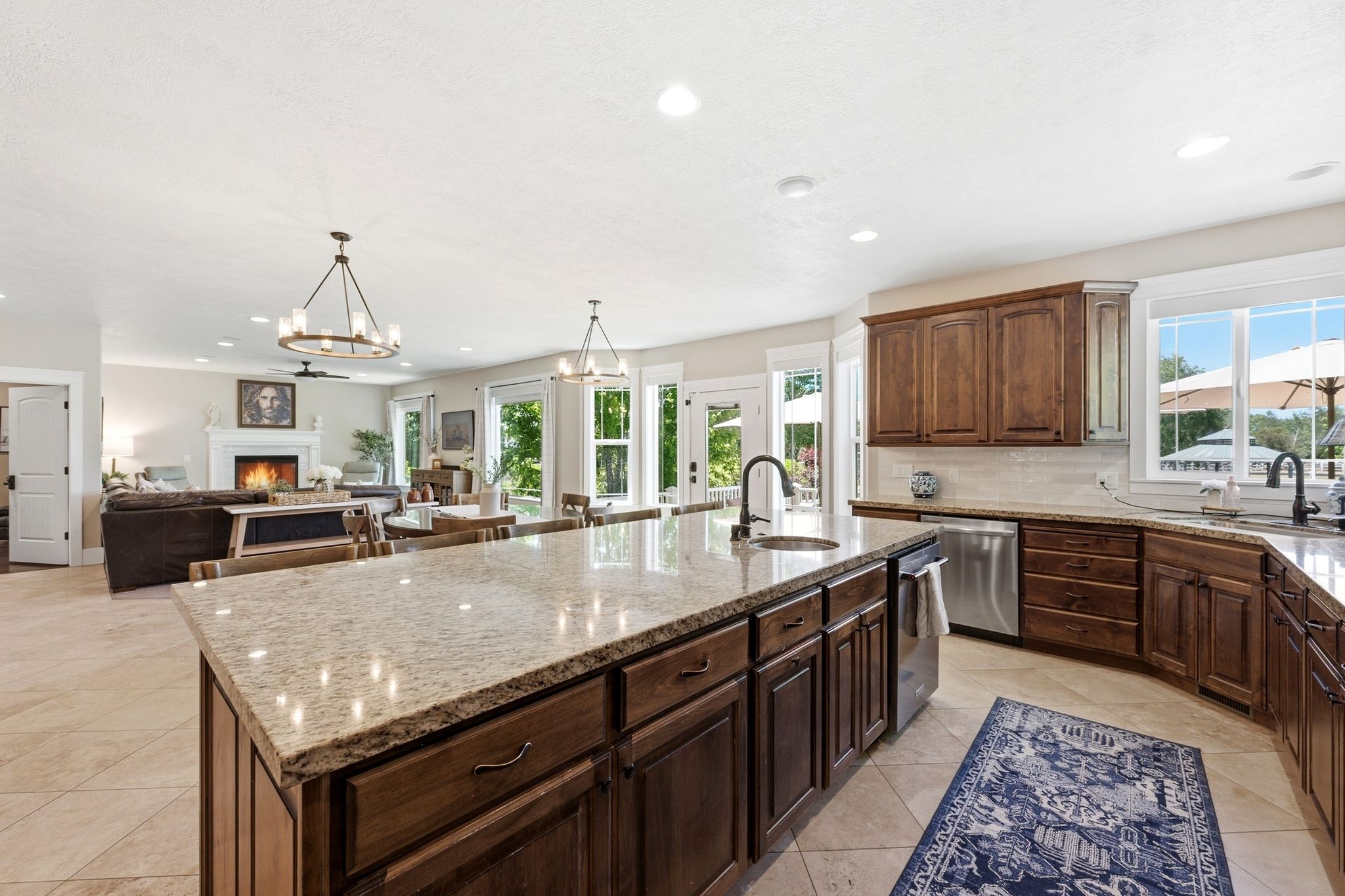 Kitchen island with light-toned countertop and integrated sink