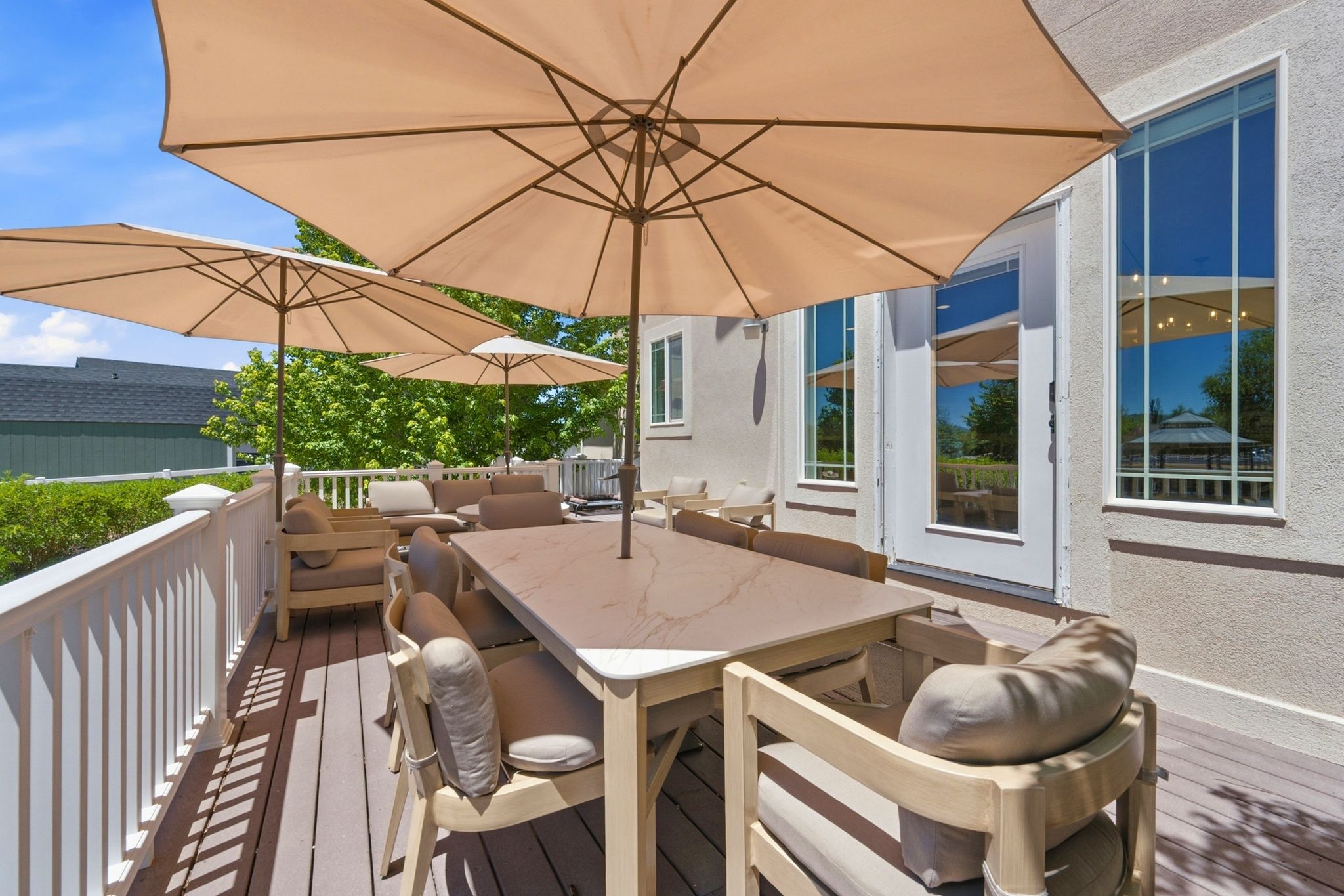 Expansive outdoor deck featuring composite decking and white railing