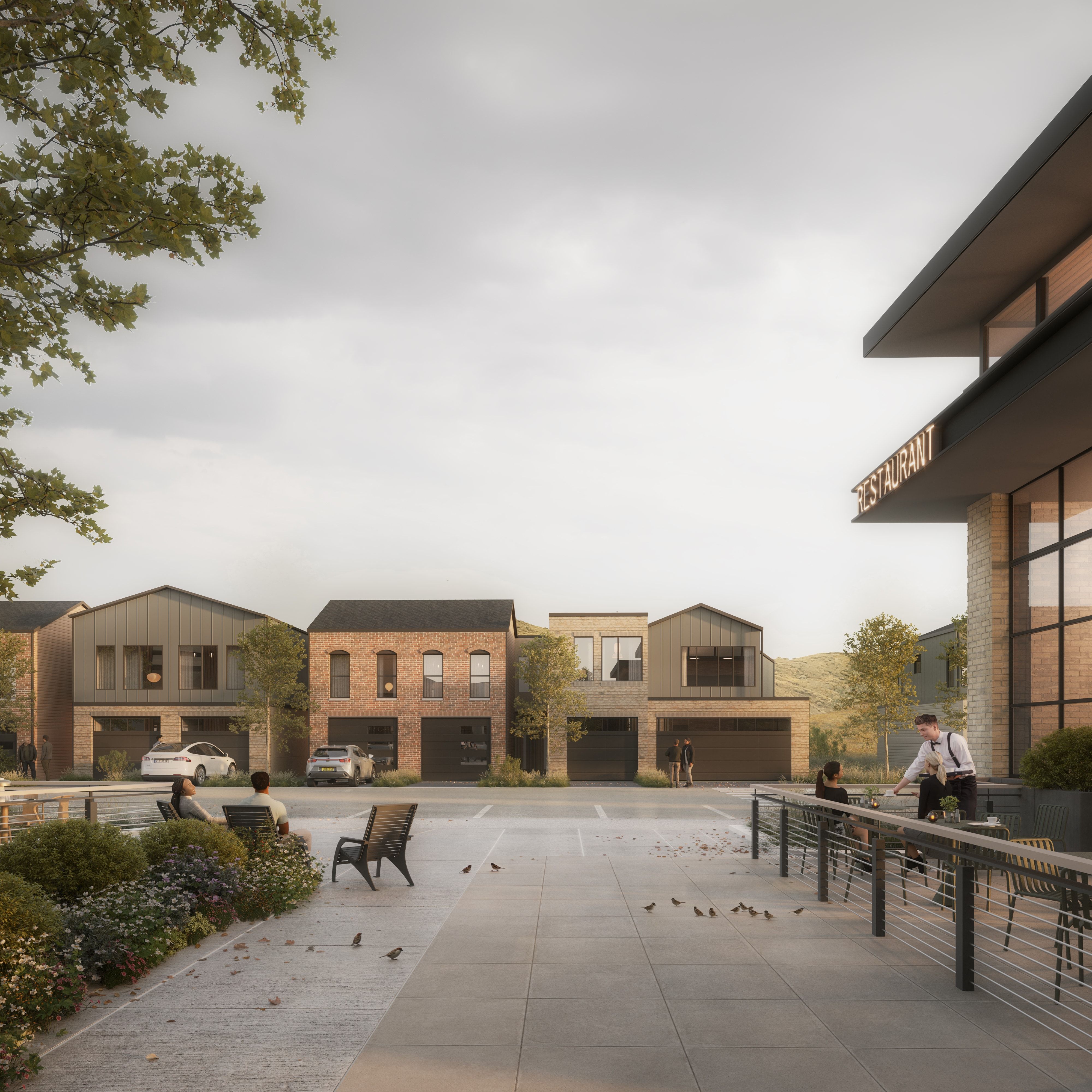 Modern townhomes featuring varied brick and vertical siding facades, integrated garages, and abundant windows