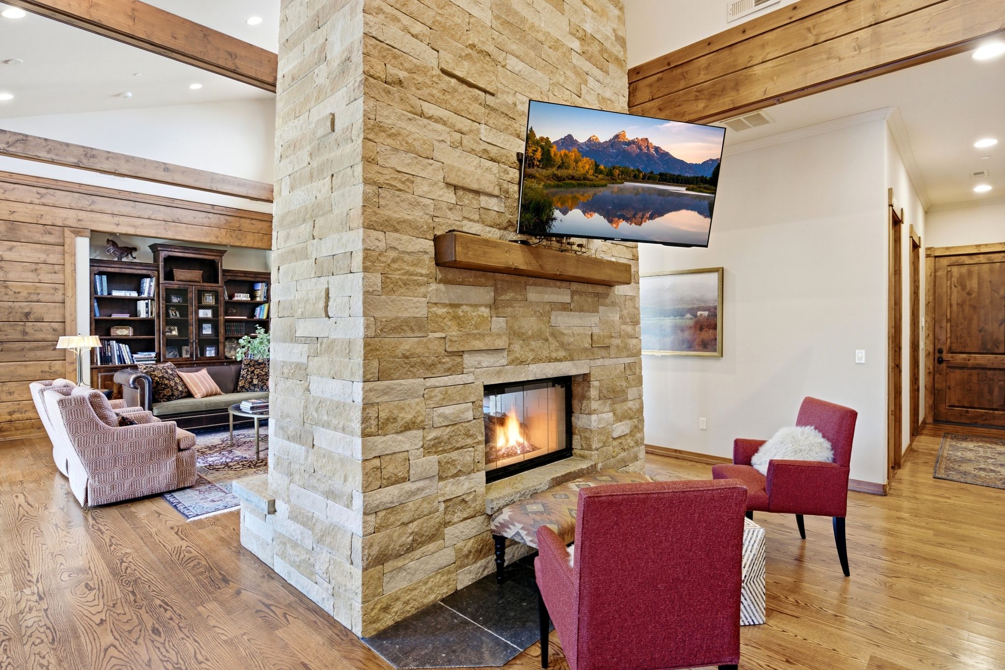 Stone-clad fireplace with a wood mantel