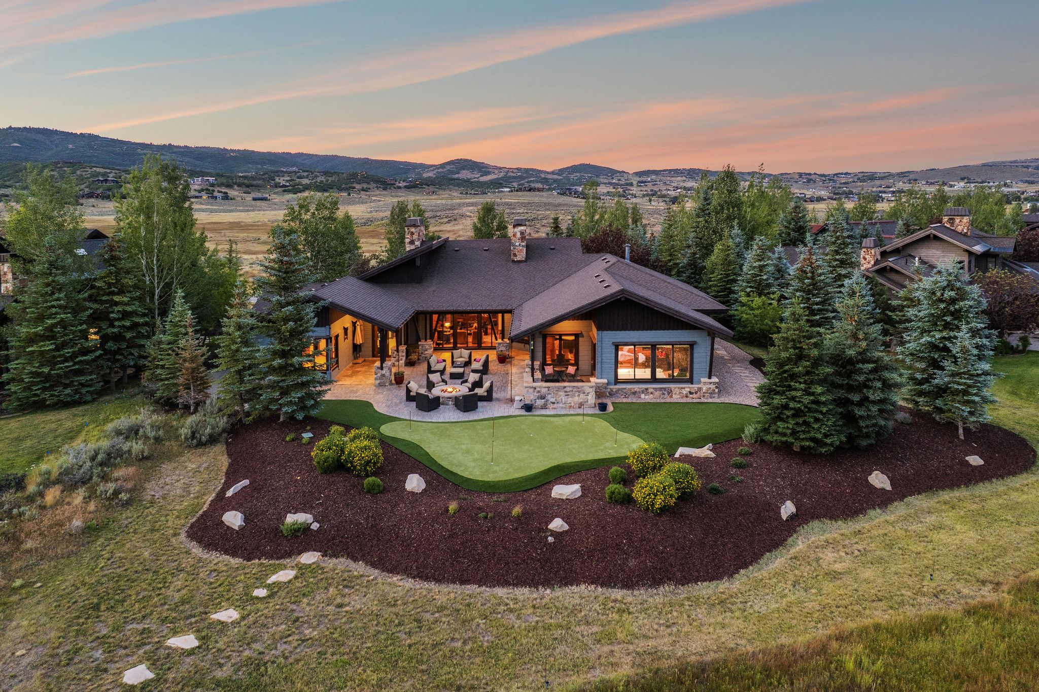 Spacious single-story residence with a dark roof and light-colored siding