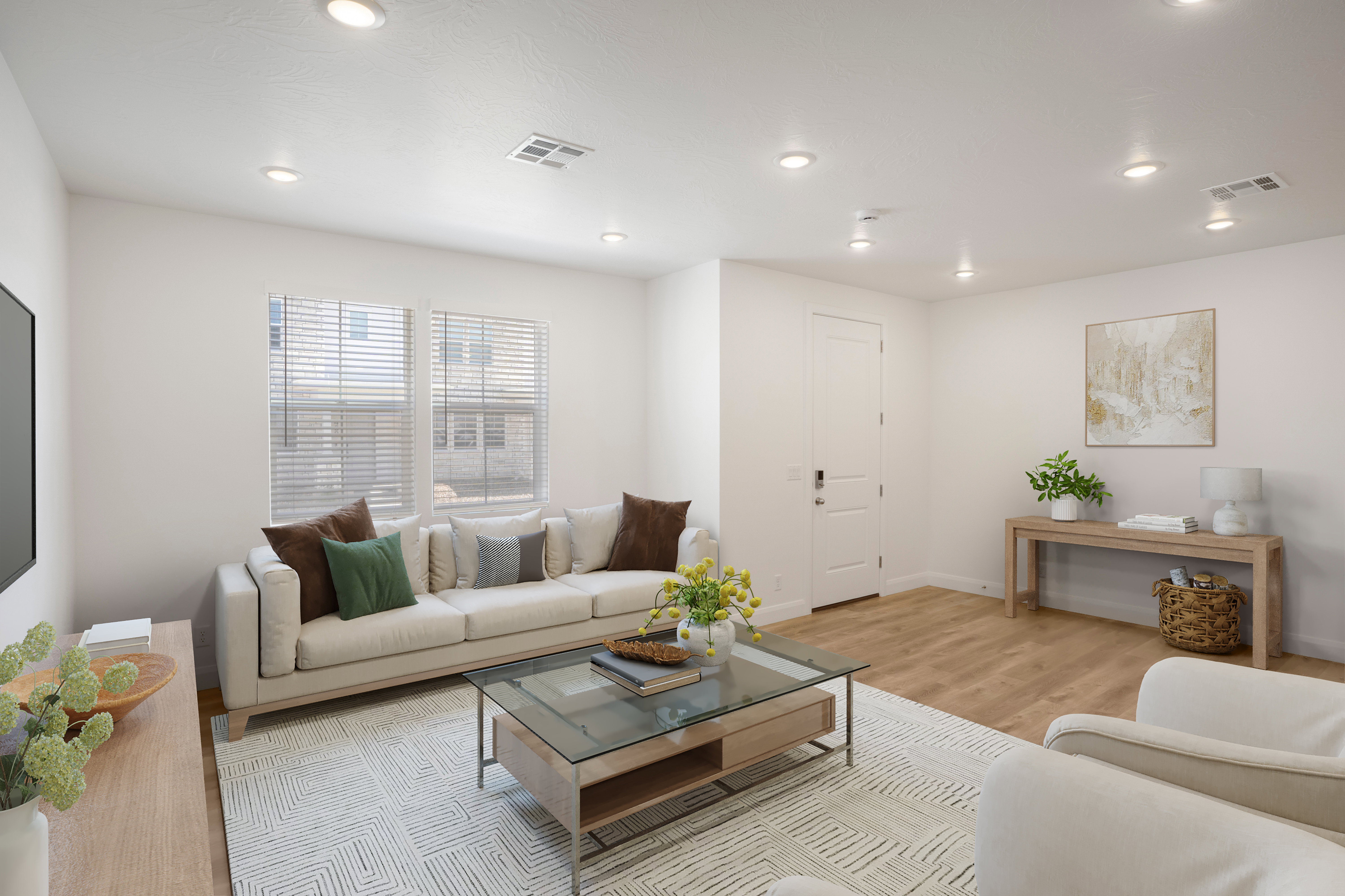 Bright living area featuring recessed lighting, light wood-finish flooring, and white walls