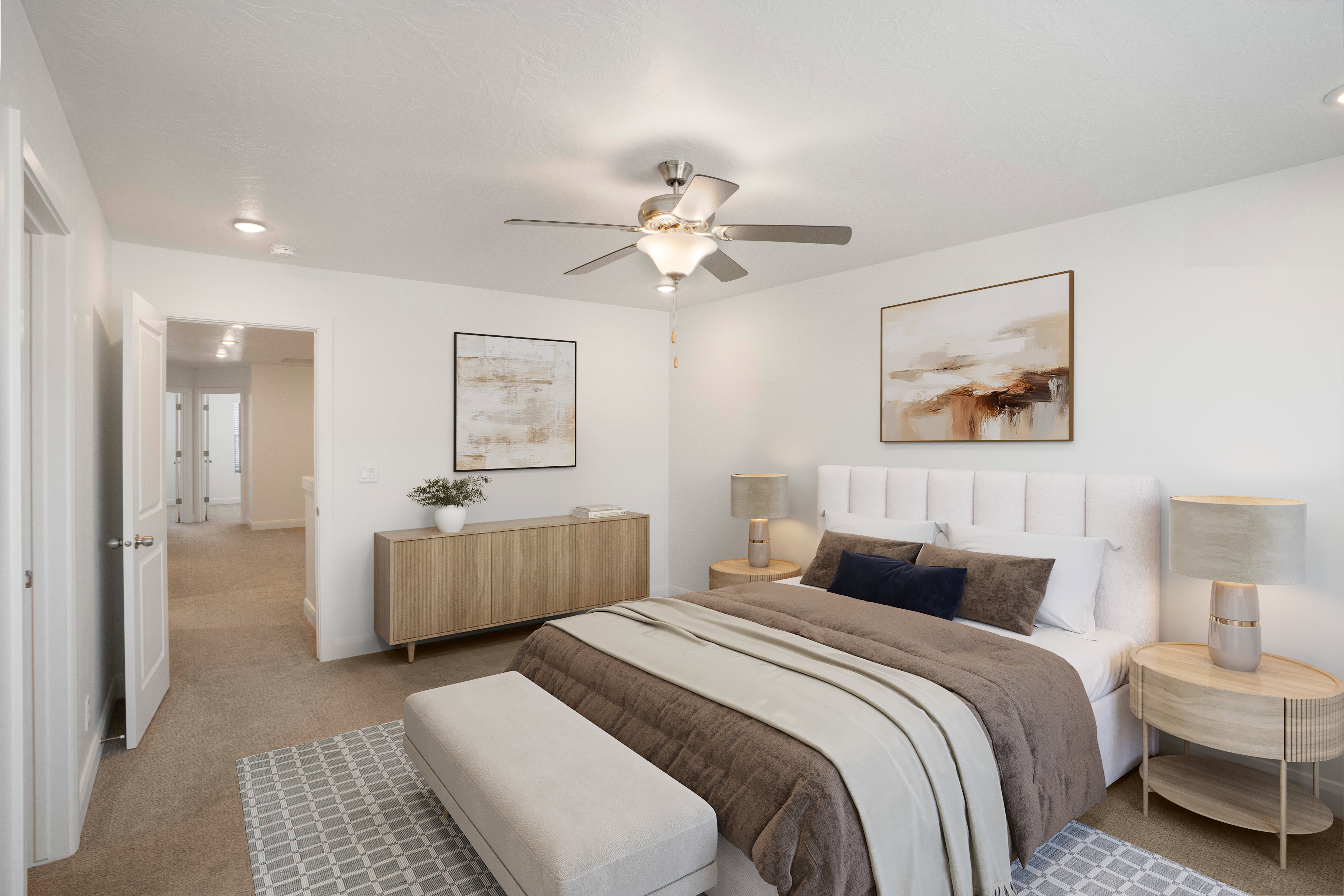 Carpeted bedroom with a white padded headboard, a ceiling fan with integrated lighting, and recessed ceiling lights