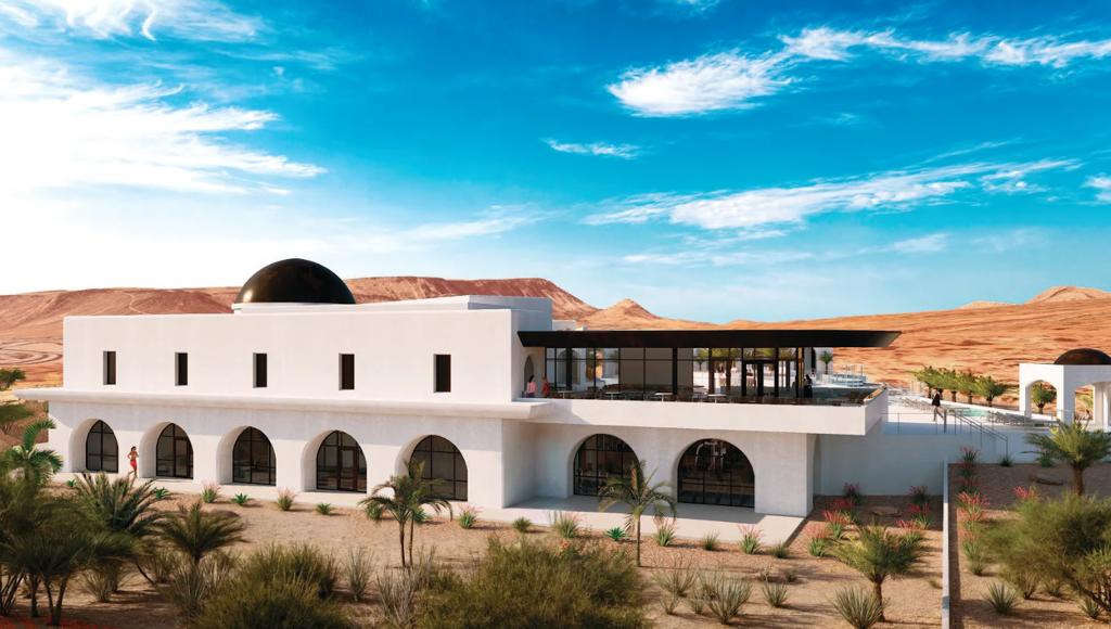 Modern white stucco exterior featuring a prominent black dome and multiple arched windows