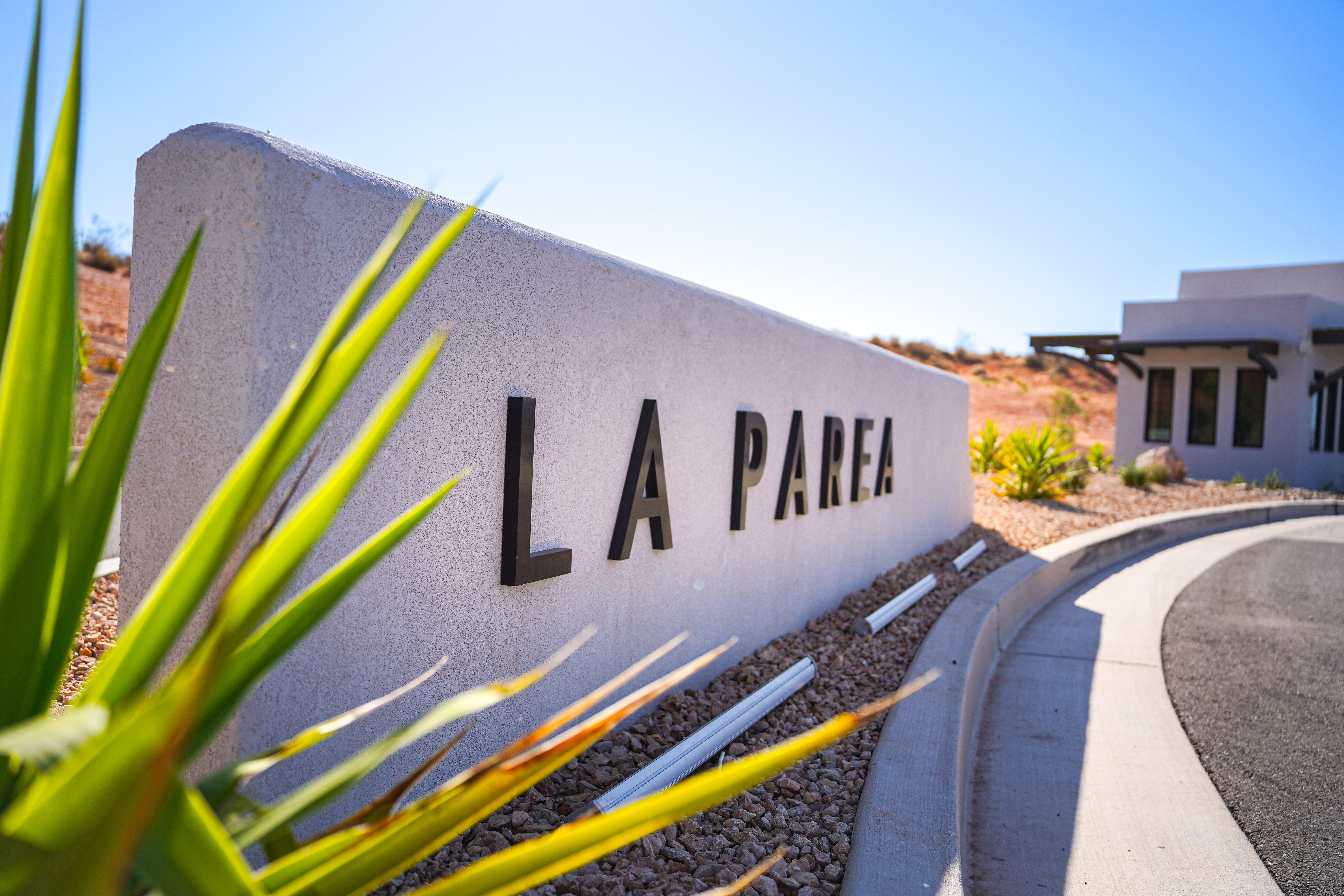 Entry monument with dimensional lettering and integrated landscaping