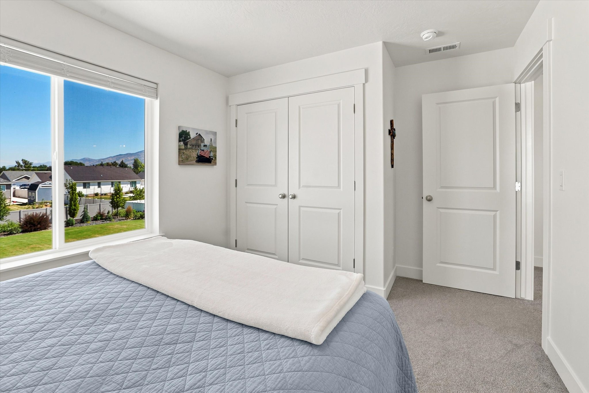 Bright interior with large window framing distant mountains