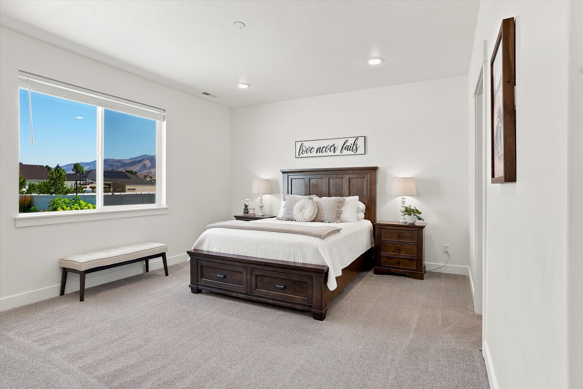 Spacious room featuring light-toned carpeting and recessed ceiling lighting