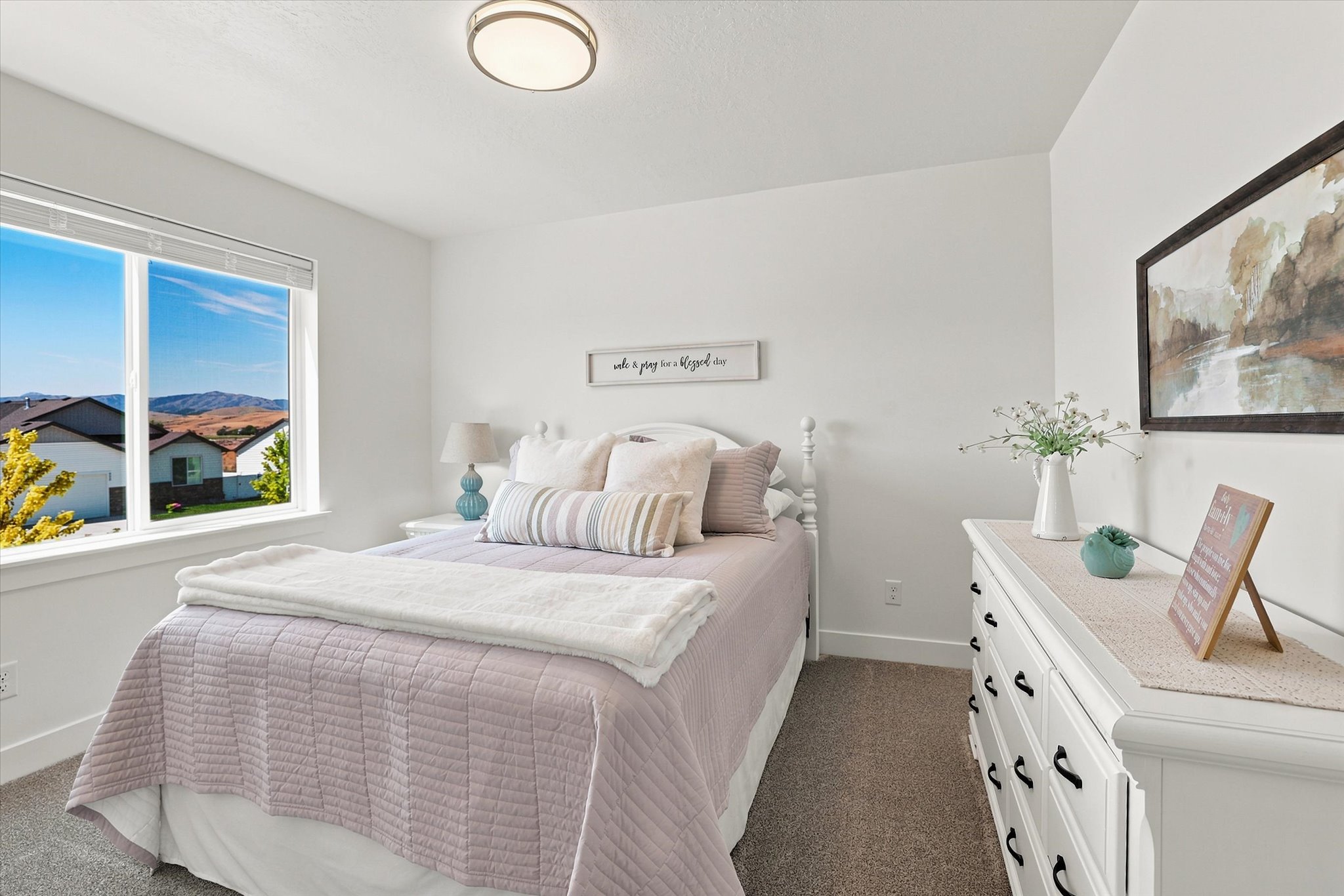 Bedroom featuring a large window, neutral paint, and carpet flooring