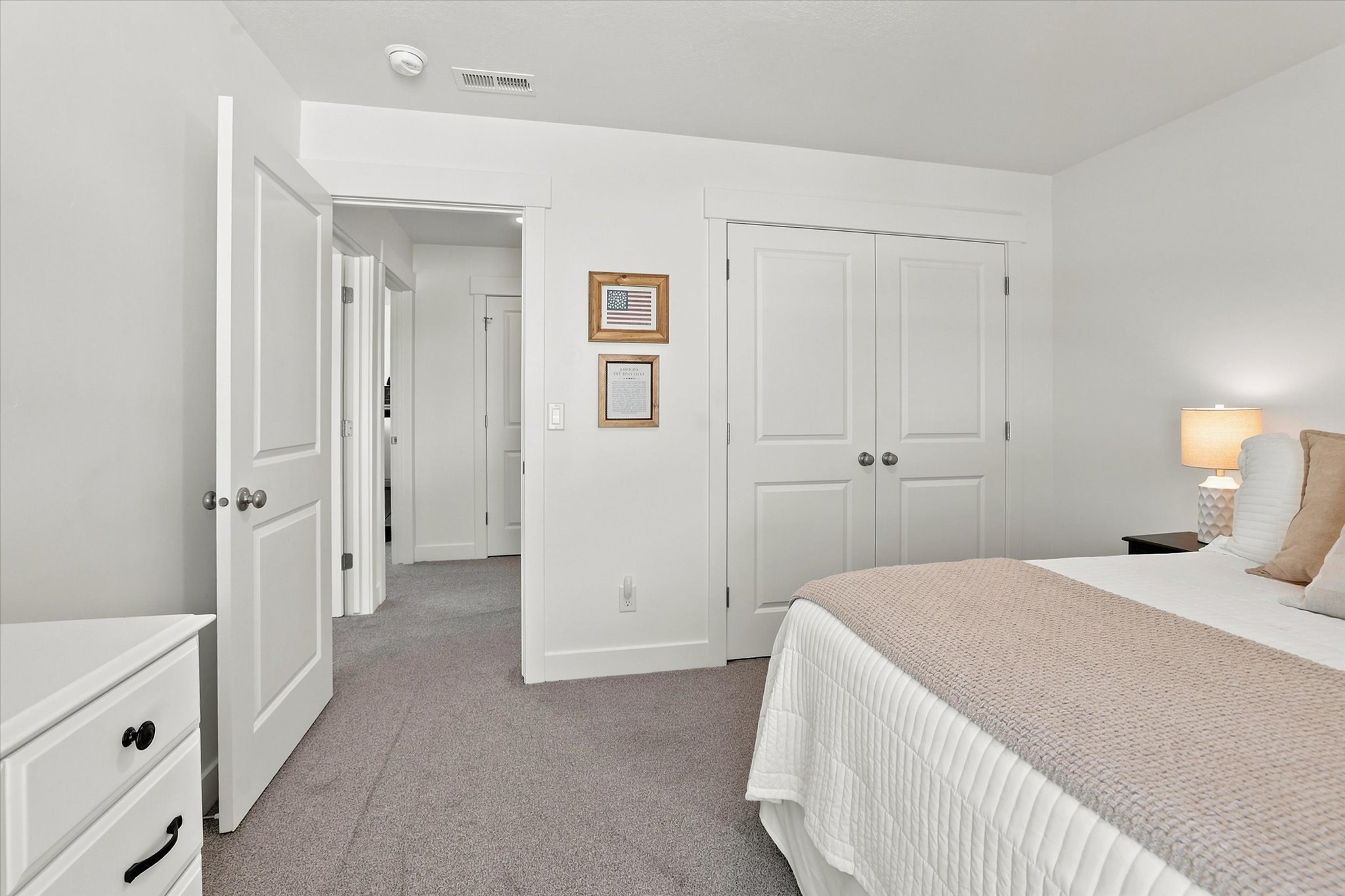 Interior room featuring neutral gray carpeting and white walls