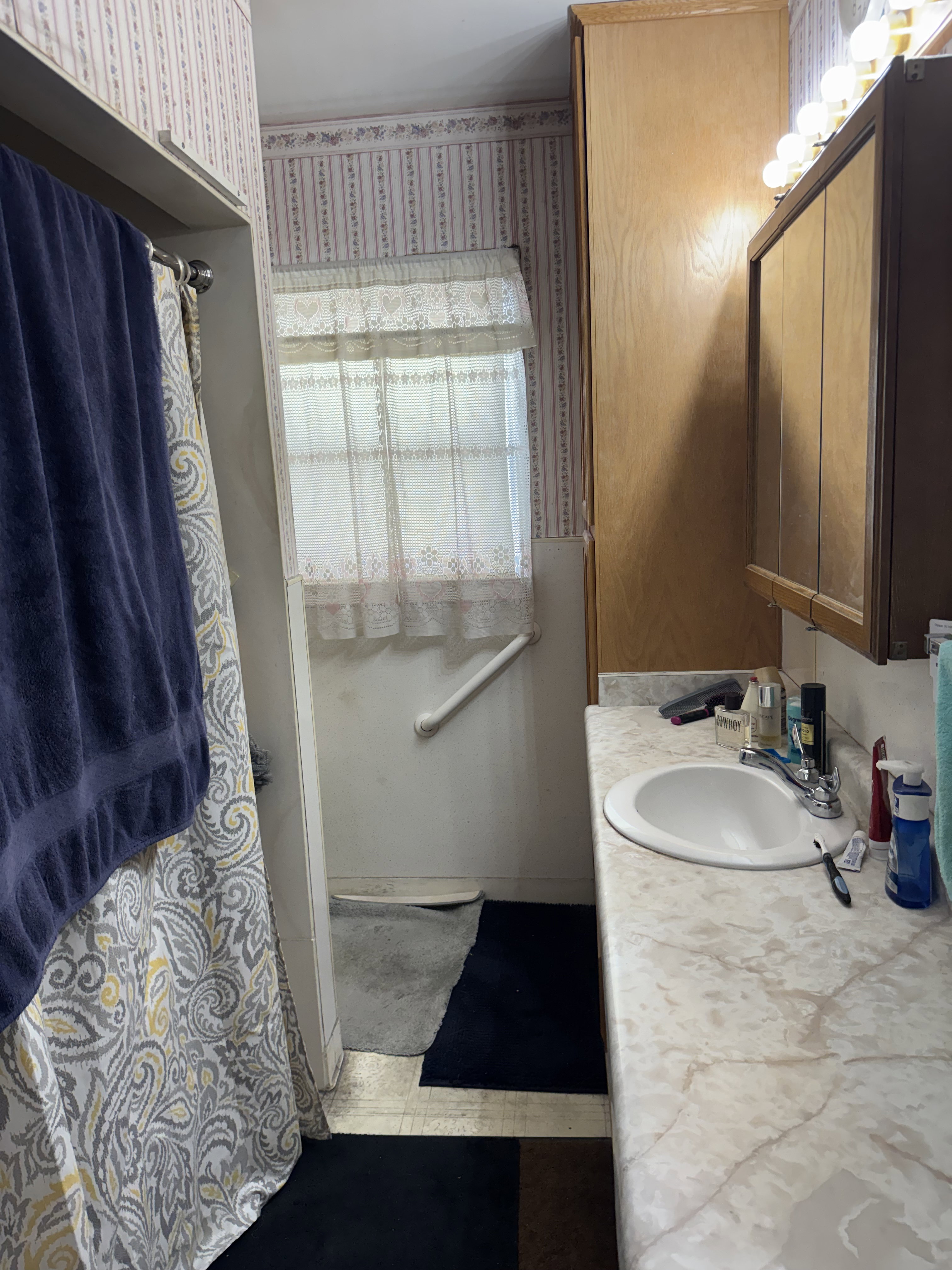 Vanity with an integrated sink and a neutral-toned countertop