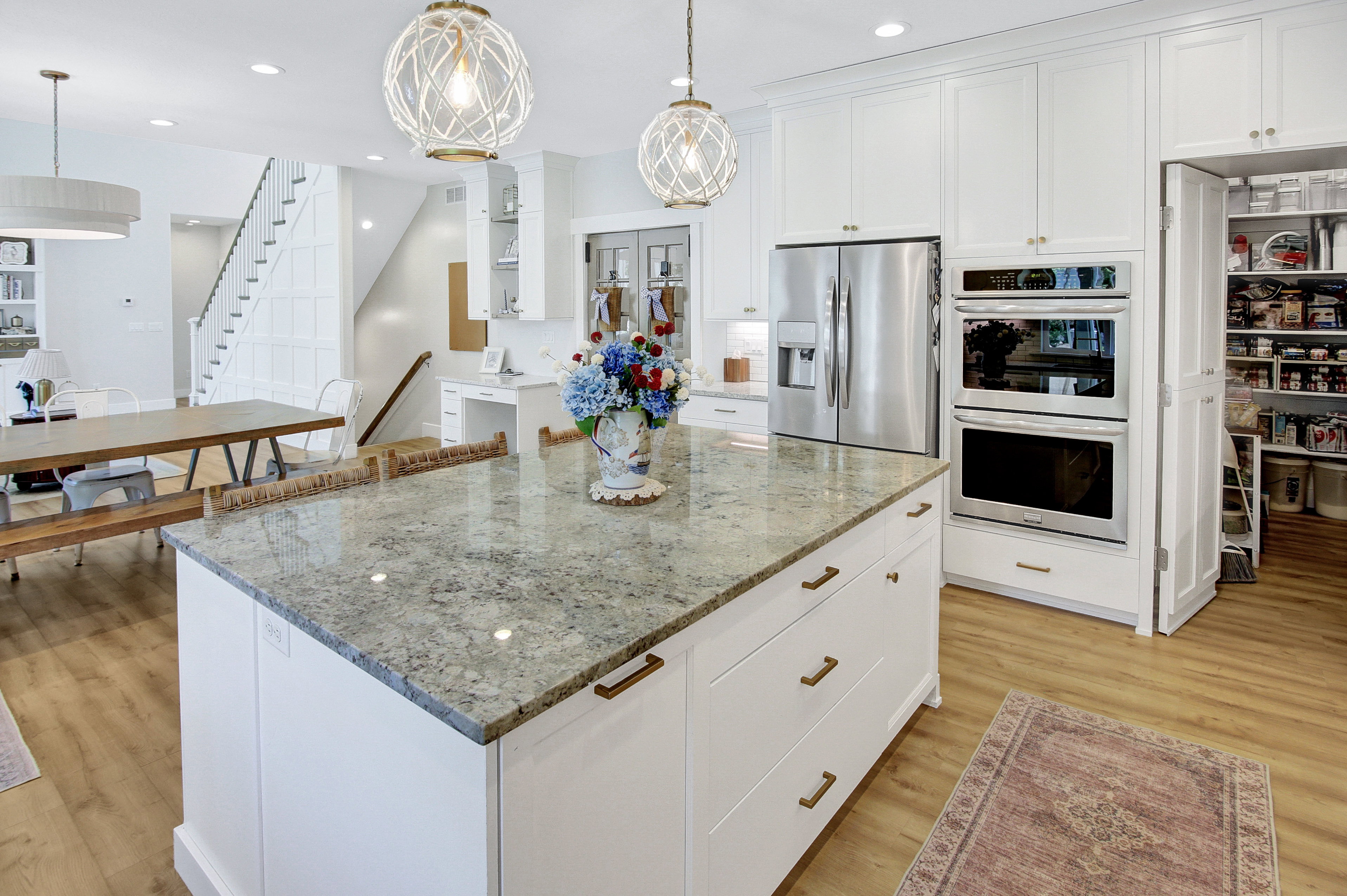 Spacious kitchen island featuring a stone countertop