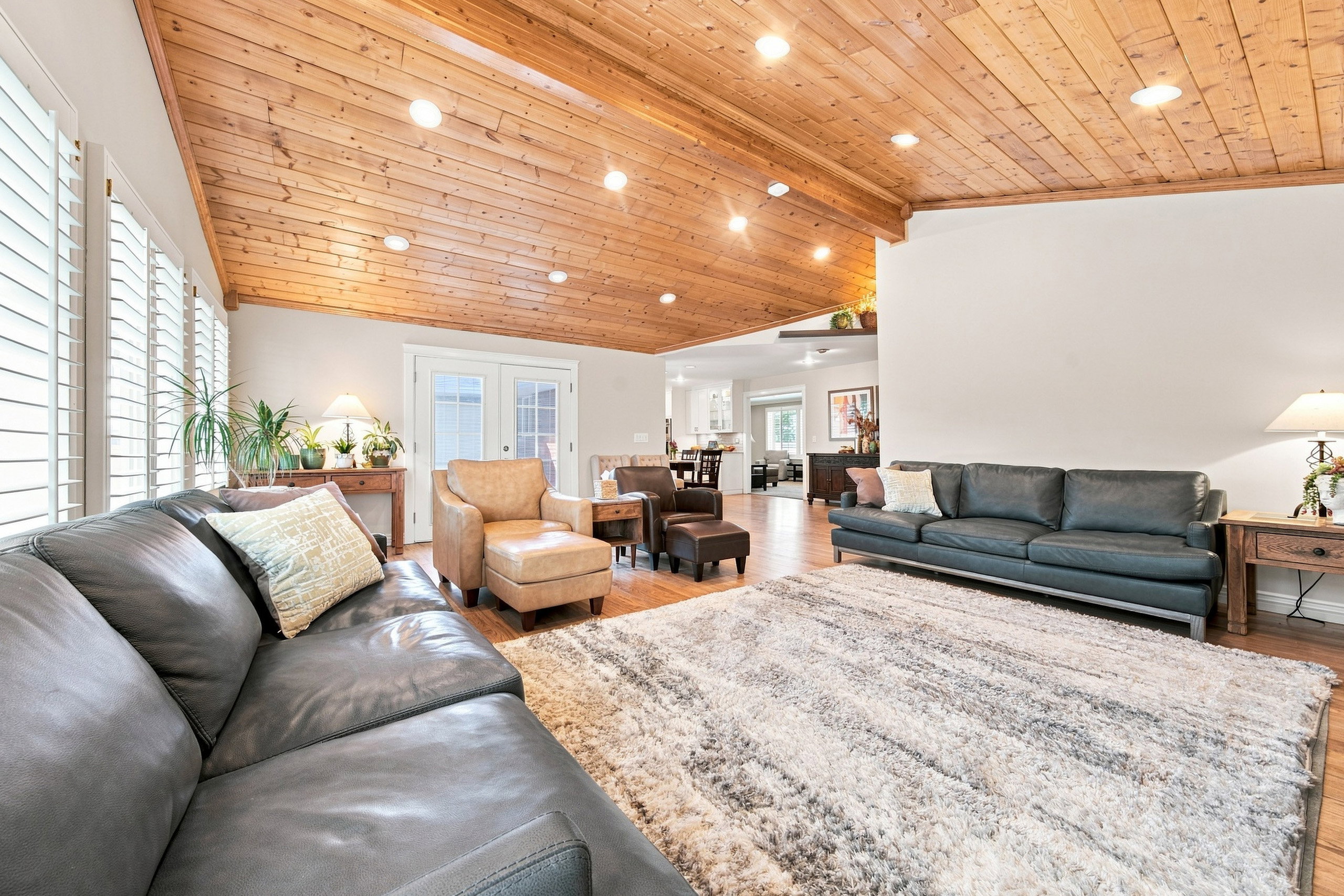 Vaulted wood-plank ceiling with recessed lighting