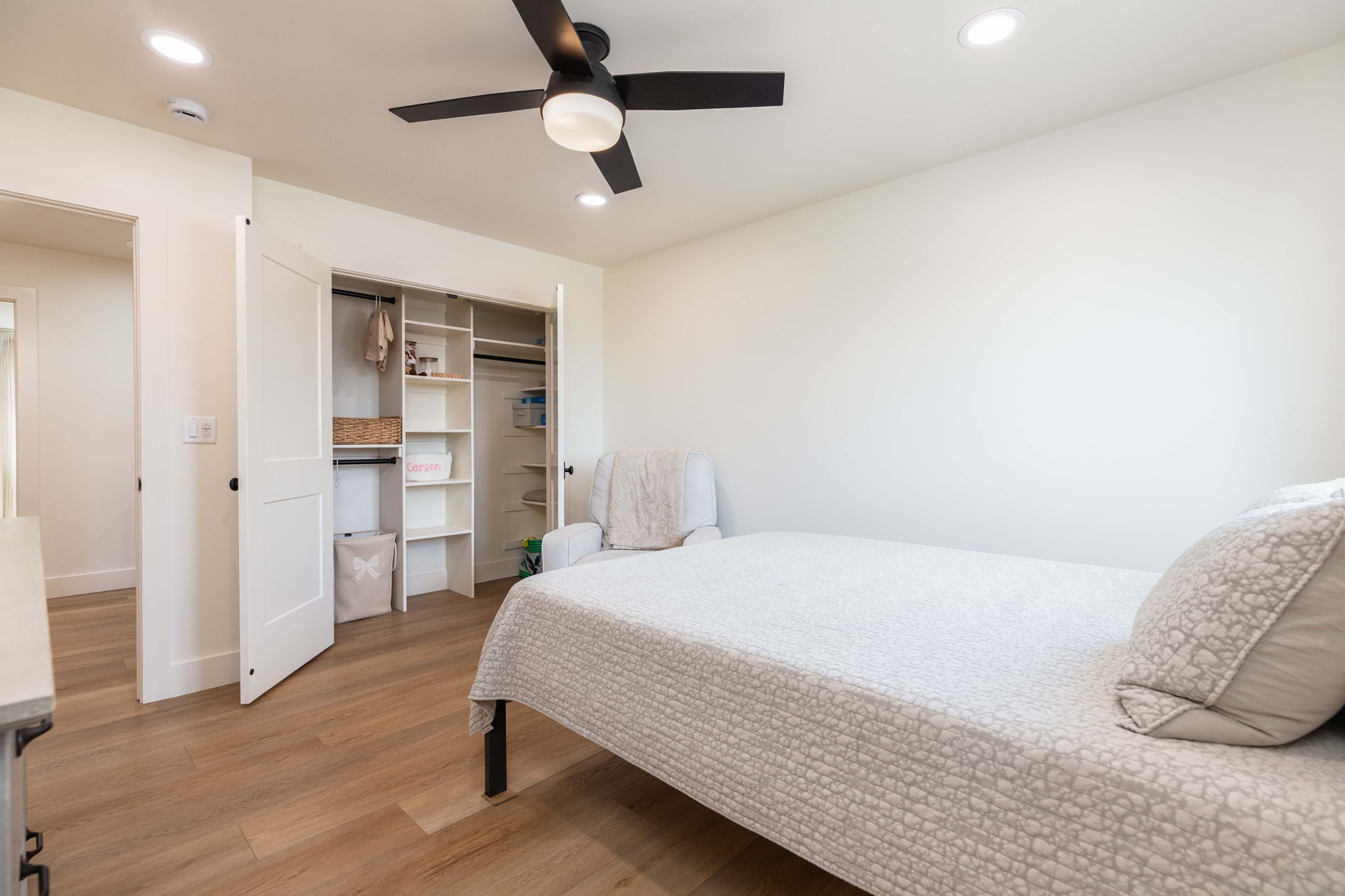 Bedroom featuring wood-finish flooring, recessed lighting, and a contemporary ceiling fan with light fixture