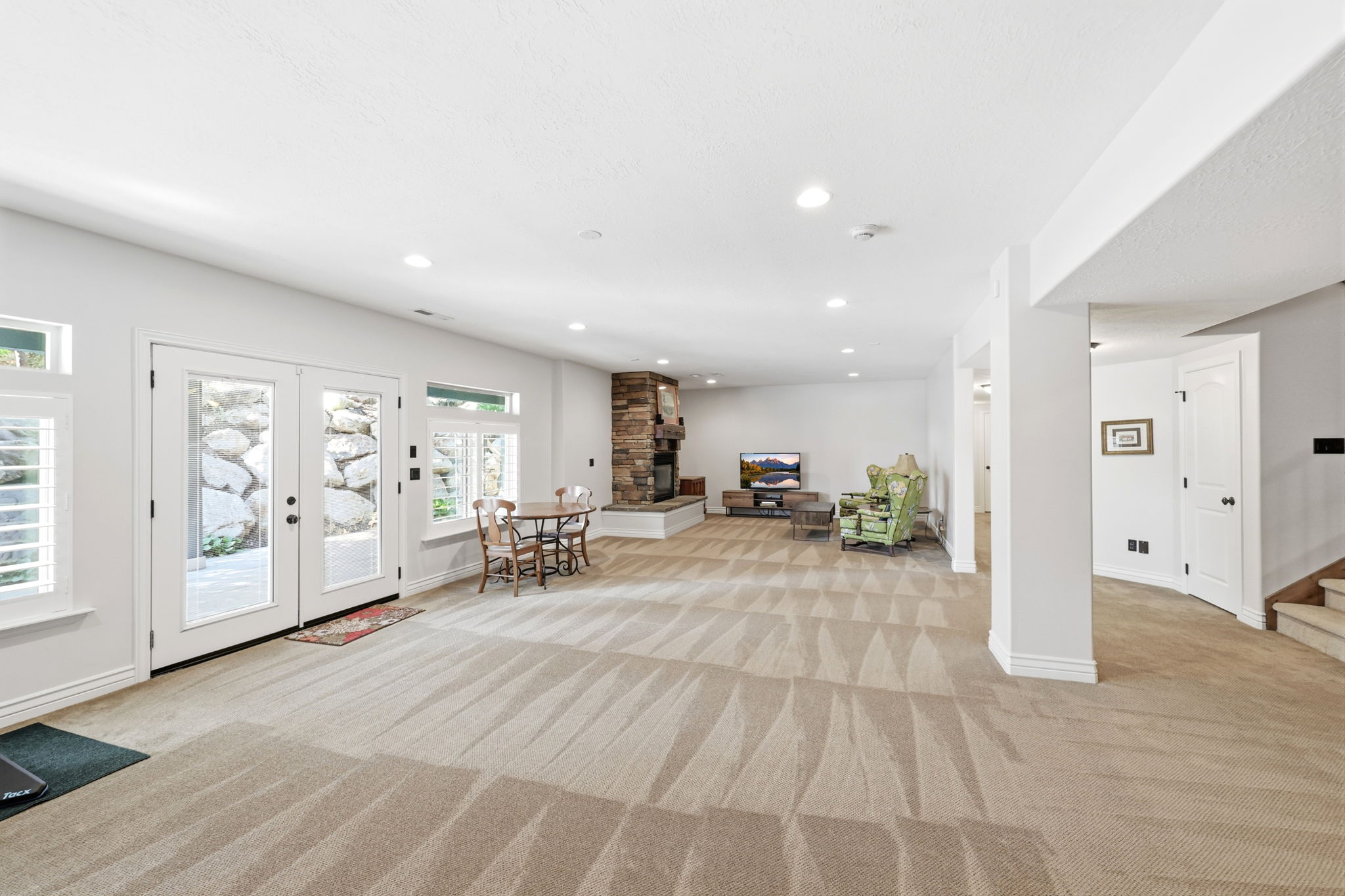 Spacious lower level featuring light-toned carpeting and recessed lighting throughout