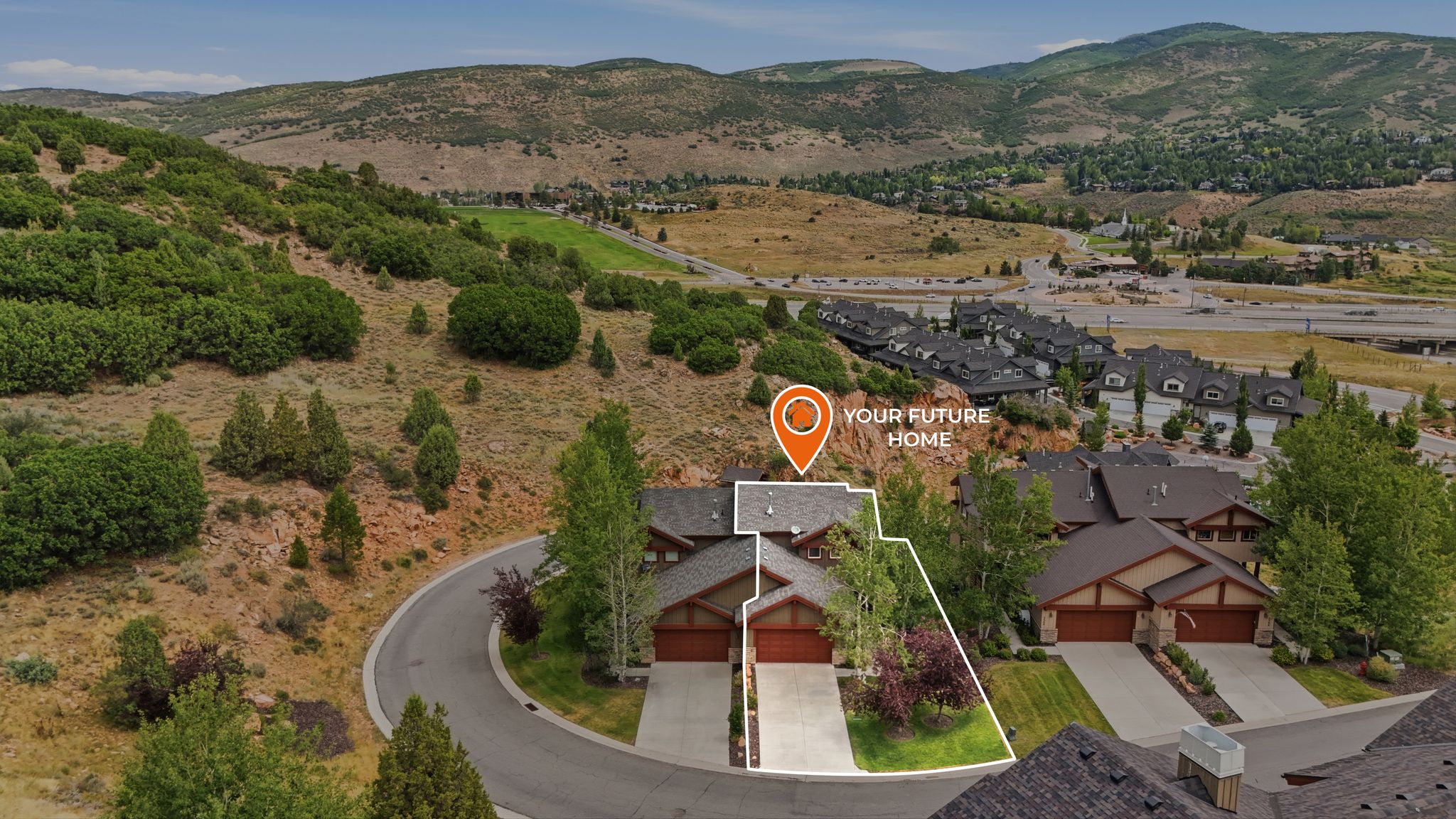 Aerial property outline featuring a two-story residence with a two-car garage, mature landscaping, and a paved driveway