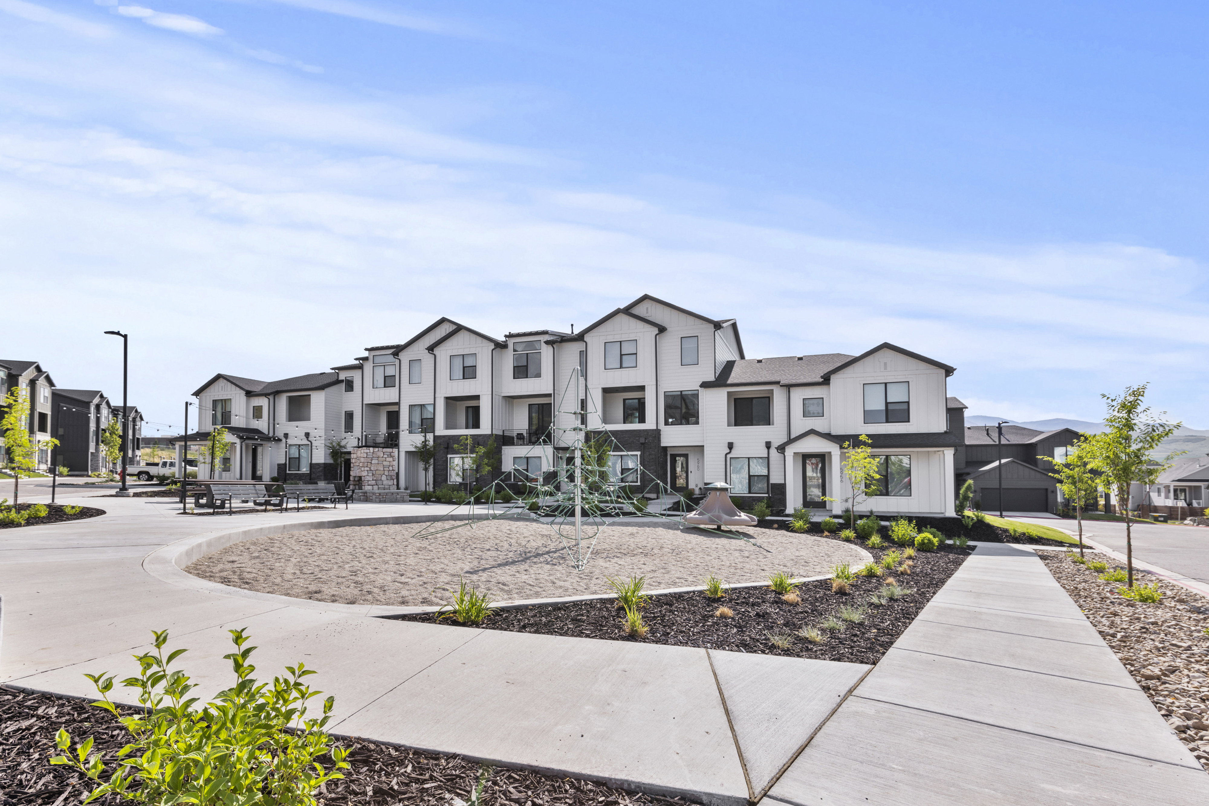 Modern townhome development featuring a neutral color palette with dark trim