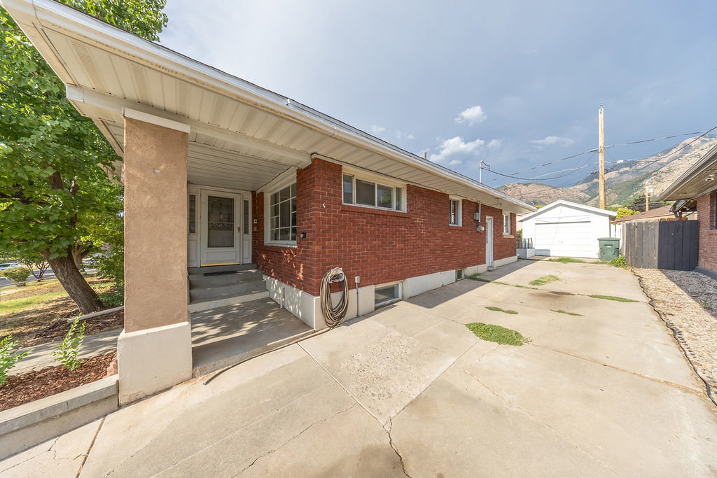Brick exterior with a covered porch entry