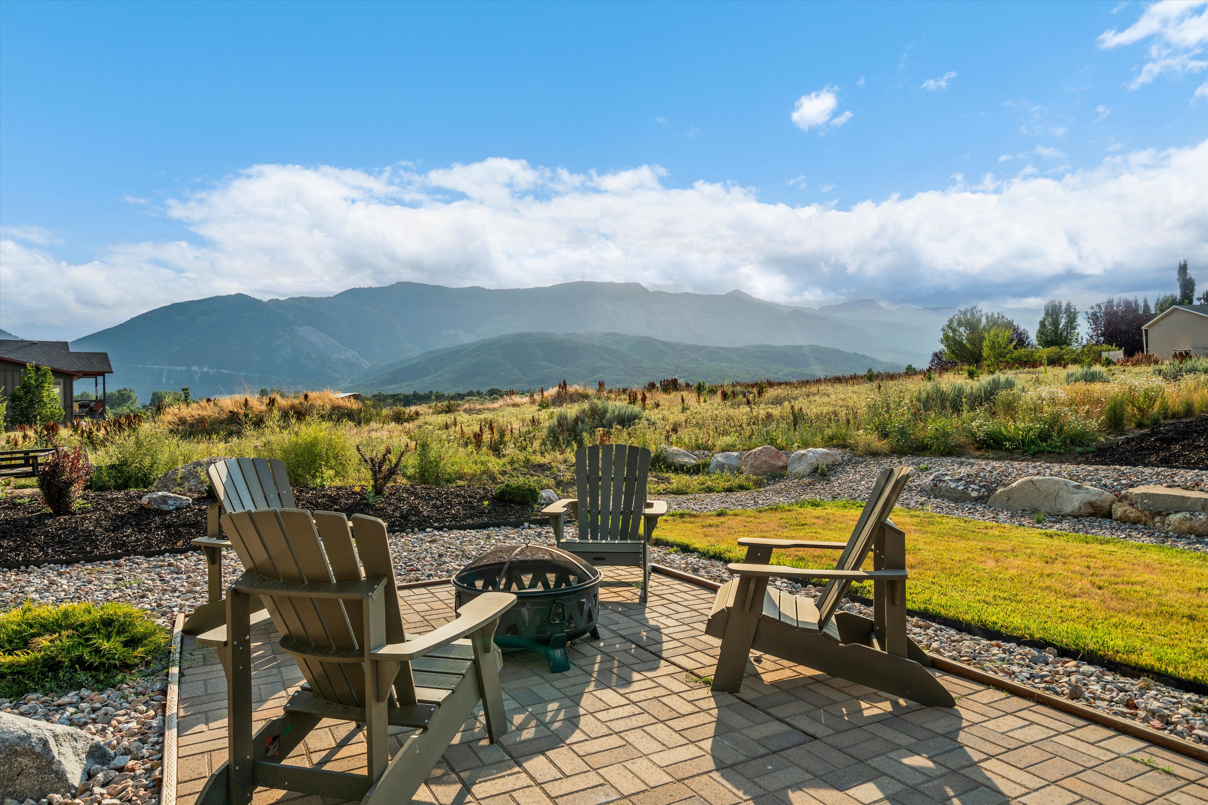 Paver patio area featuring a built-in fire pit