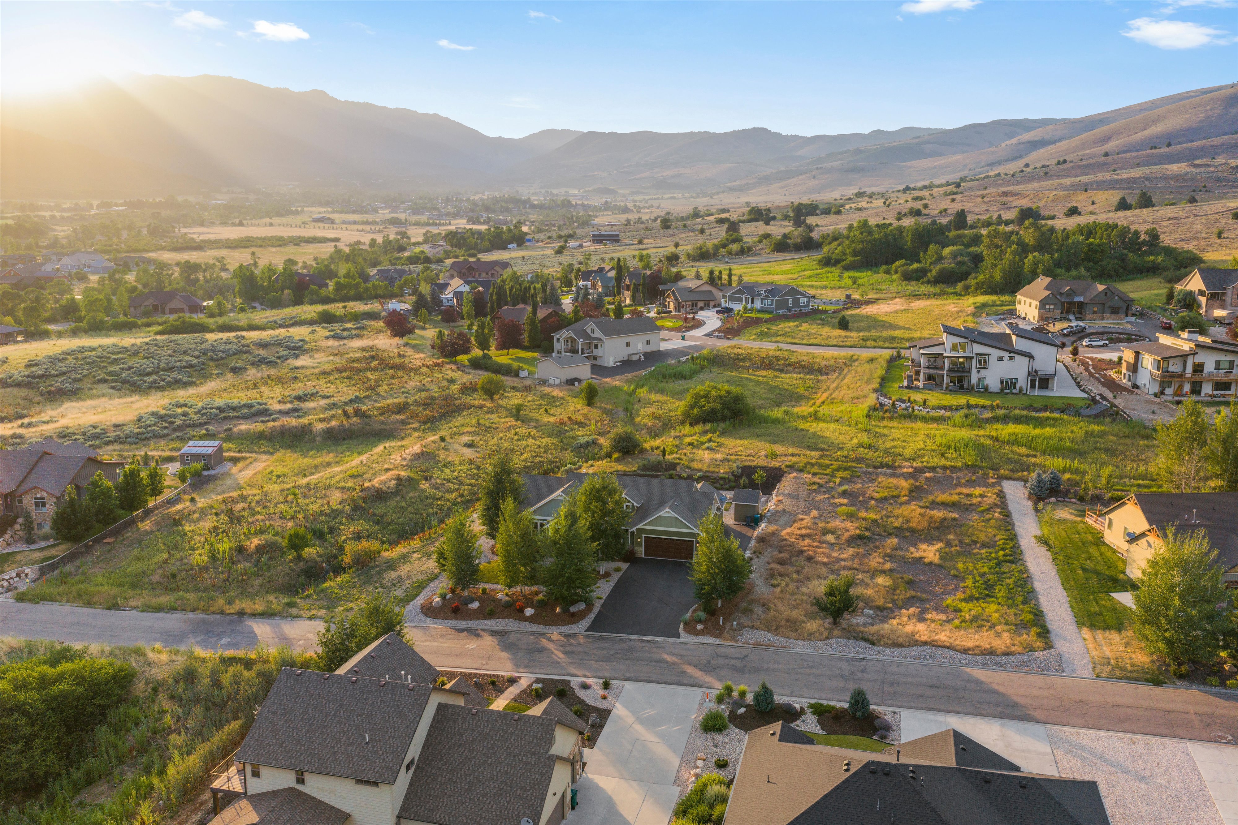 Expansive aerial perspective showcasing a residential lot with natural landscaping