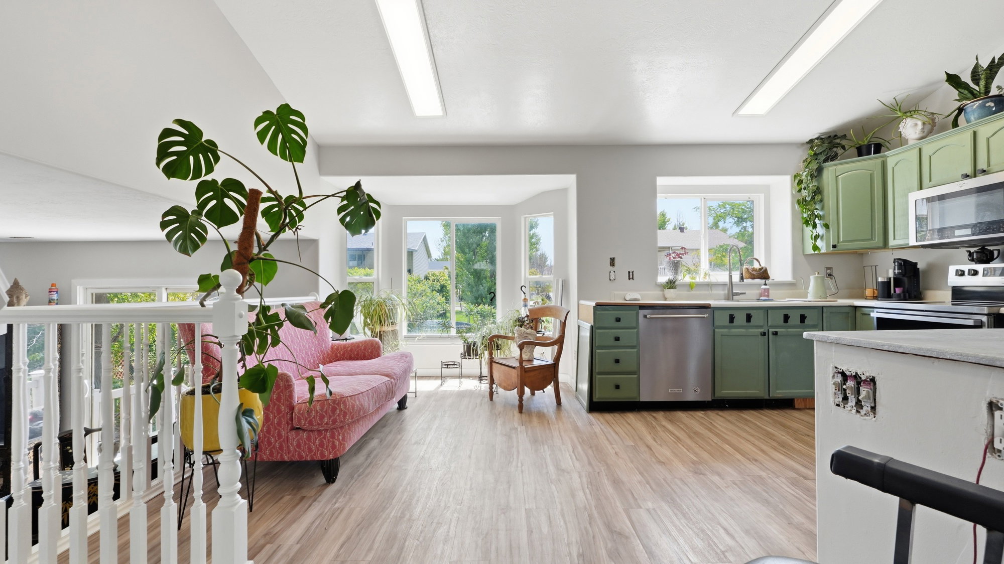 Open-concept living space featuring wood-finish flooring throughout