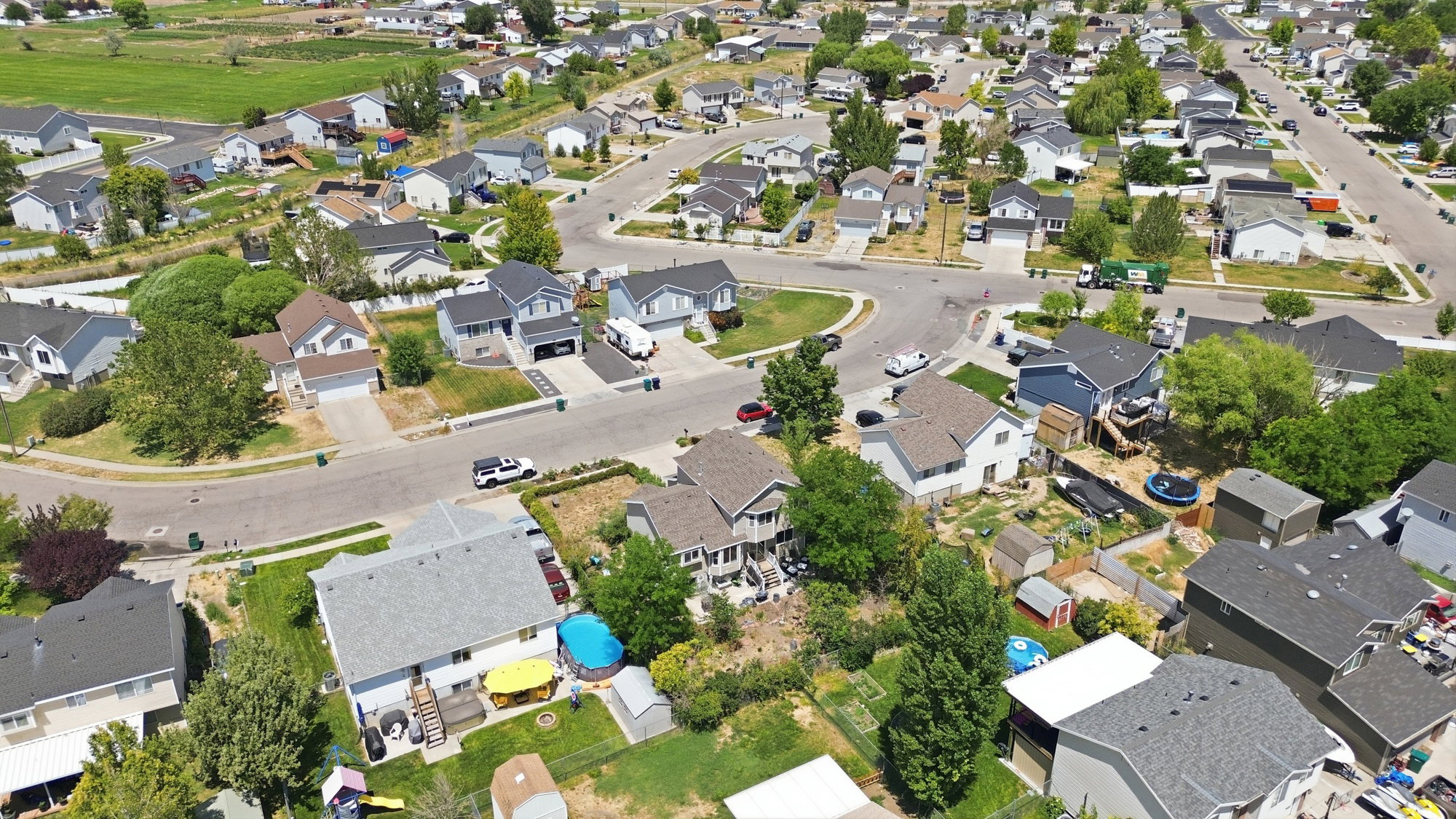 Residential neighborhood featuring a grid-pattern street layout, established homes with varied architectural styles, and mature landscaping