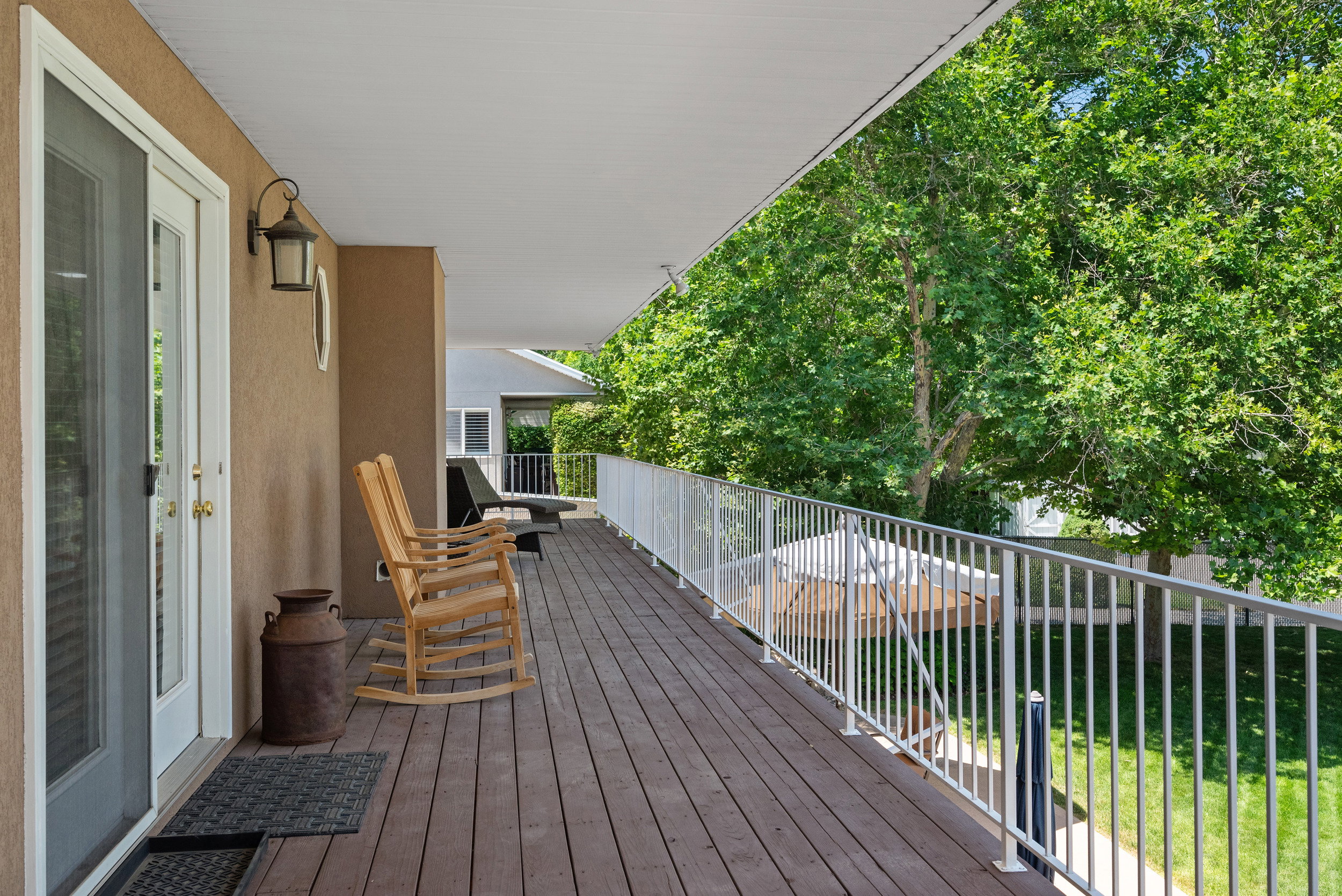 Covered deck extends the length of the home