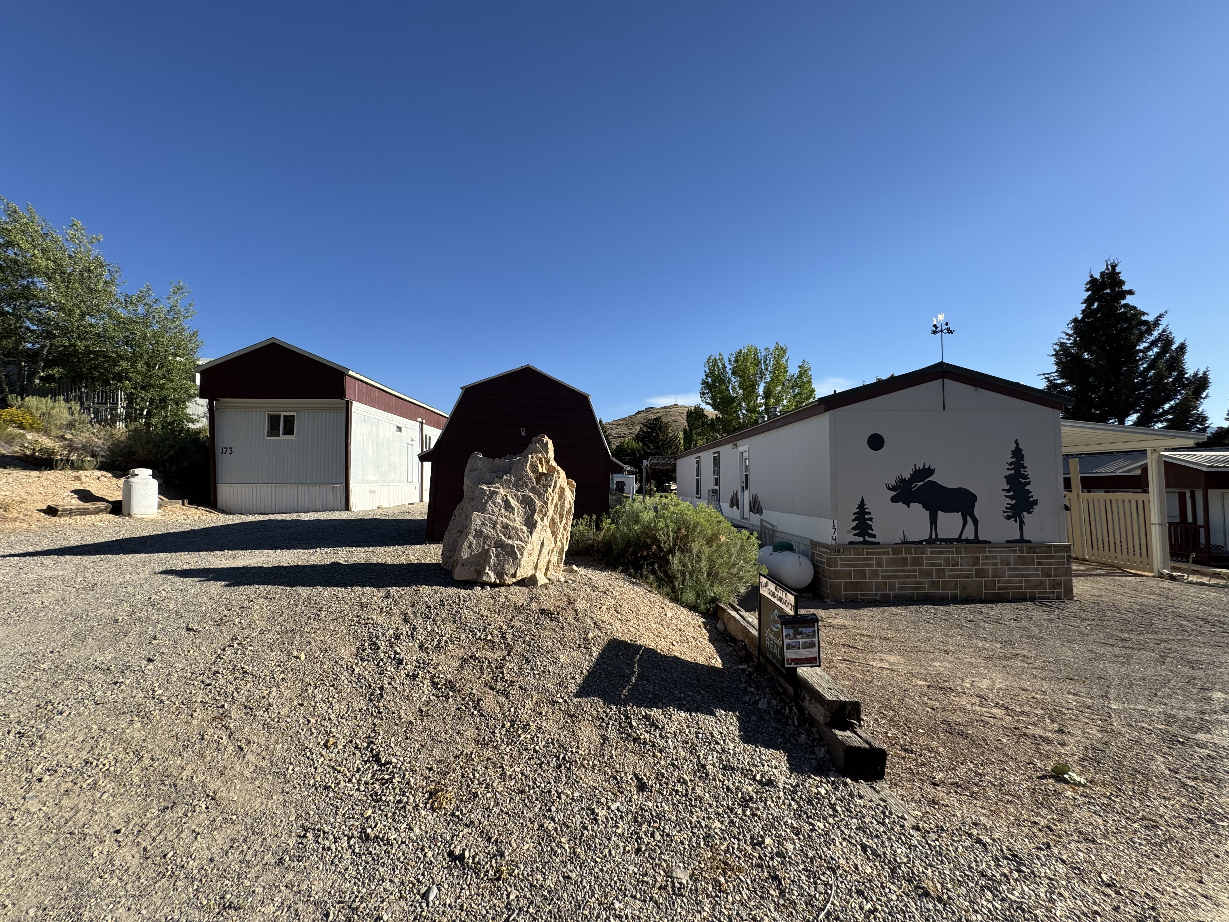 Gravel driveway providing access to multiple structures