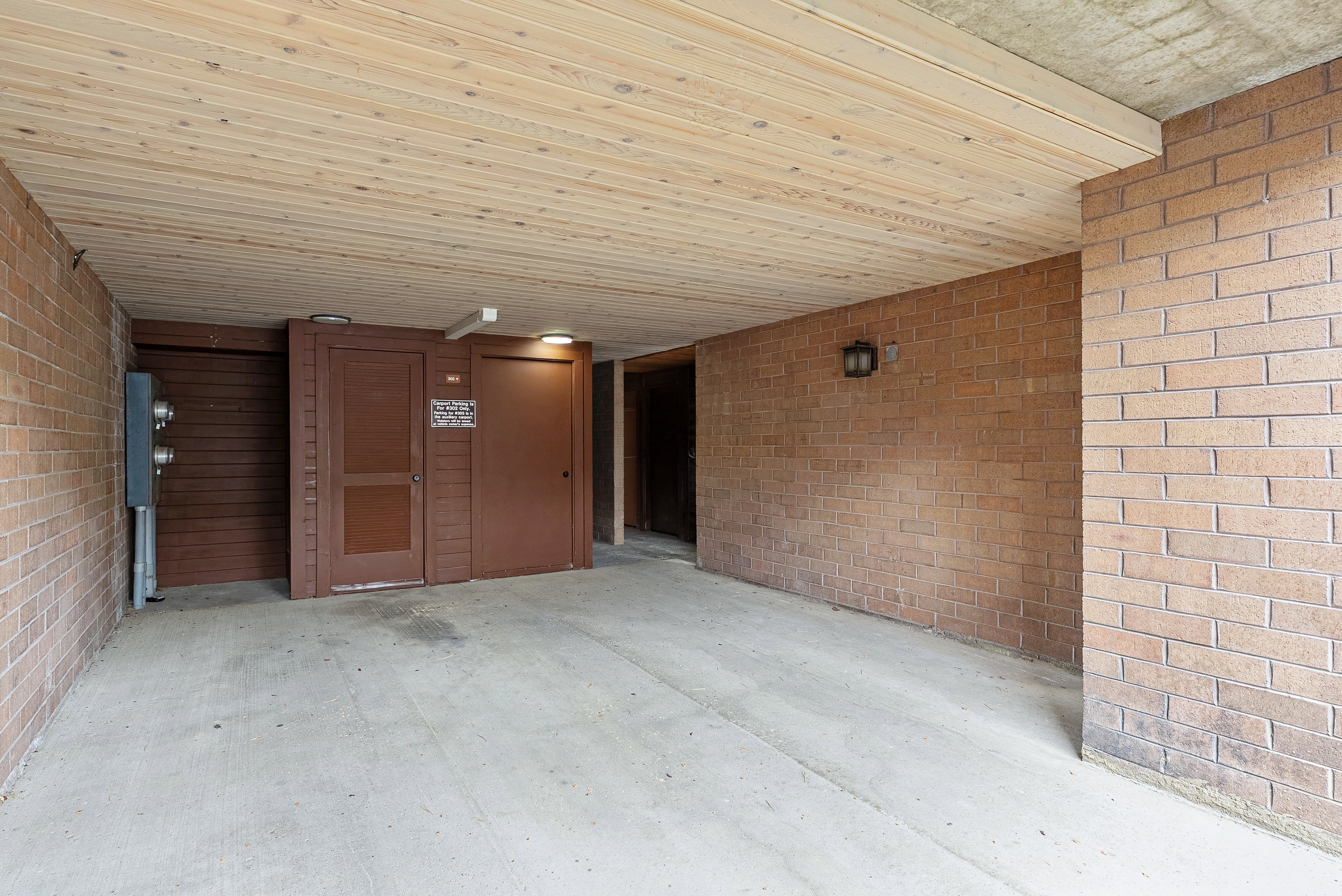 Concrete flooring with a wood-finish plank ceiling