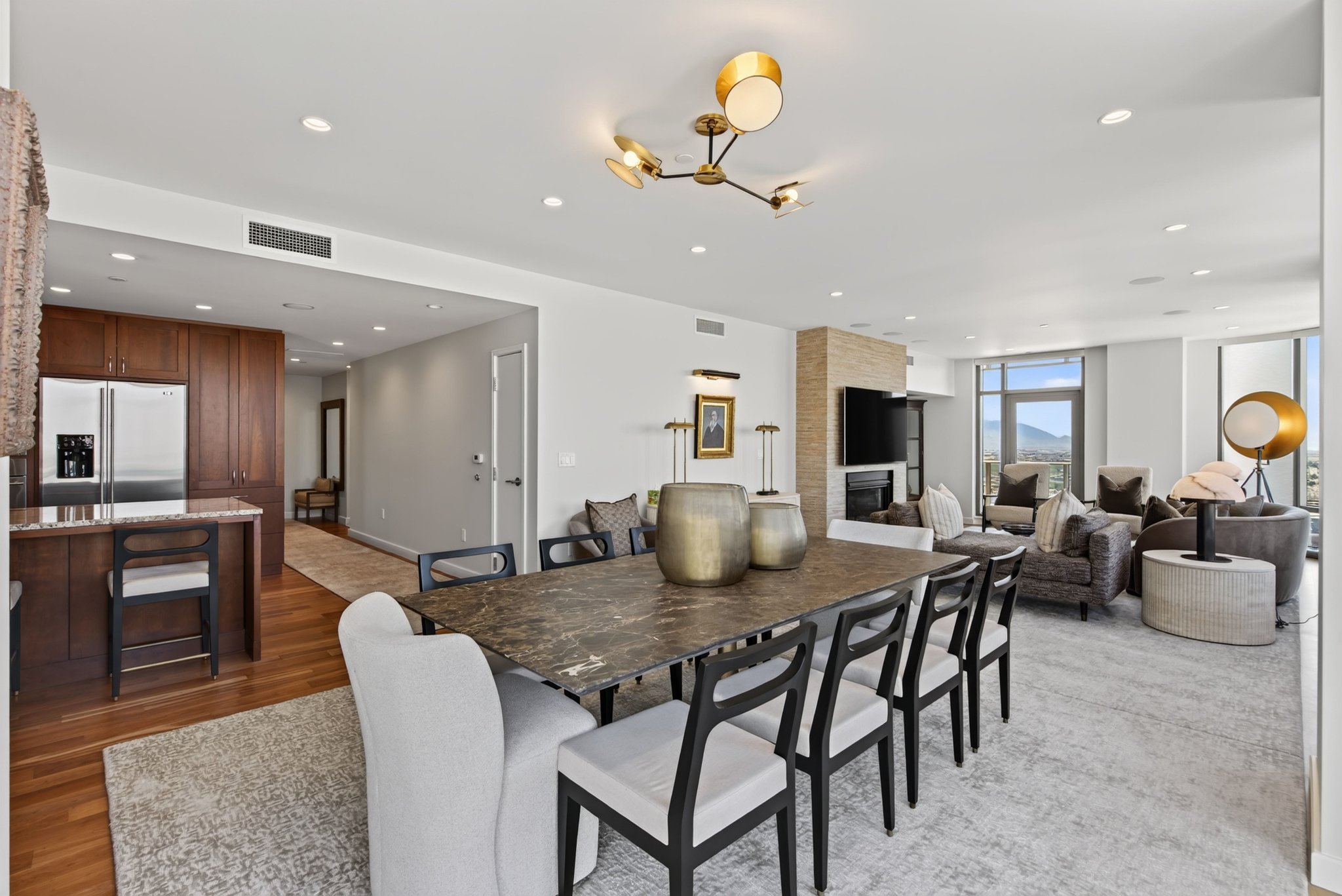 Expansive open-concept living space featuring a dining area, kitchen, and living room