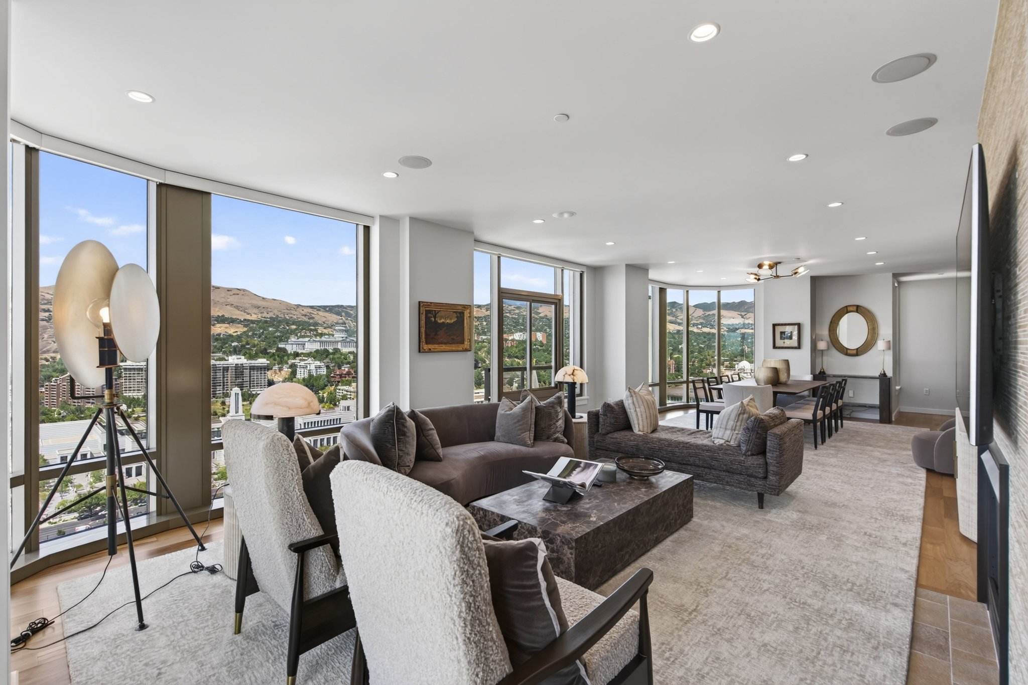 Open-concept living area with extensive floor-to-ceiling windows