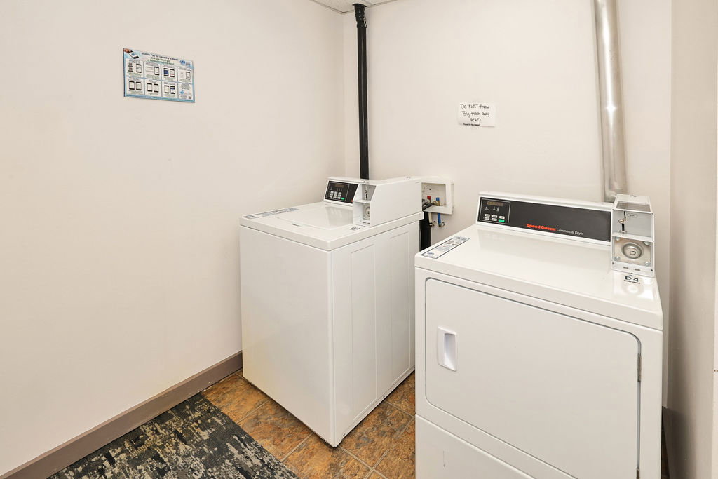 Laundry area directly across the hall from this condo