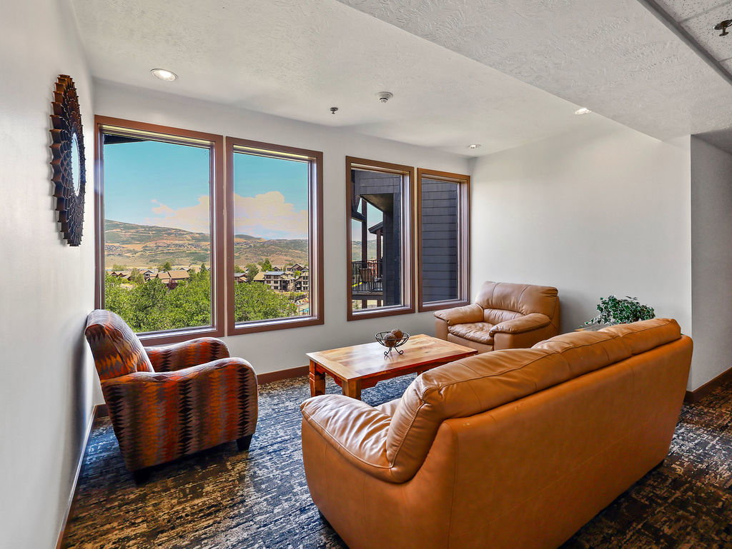 Cozy sitting area with views, next to this condo's entrance door