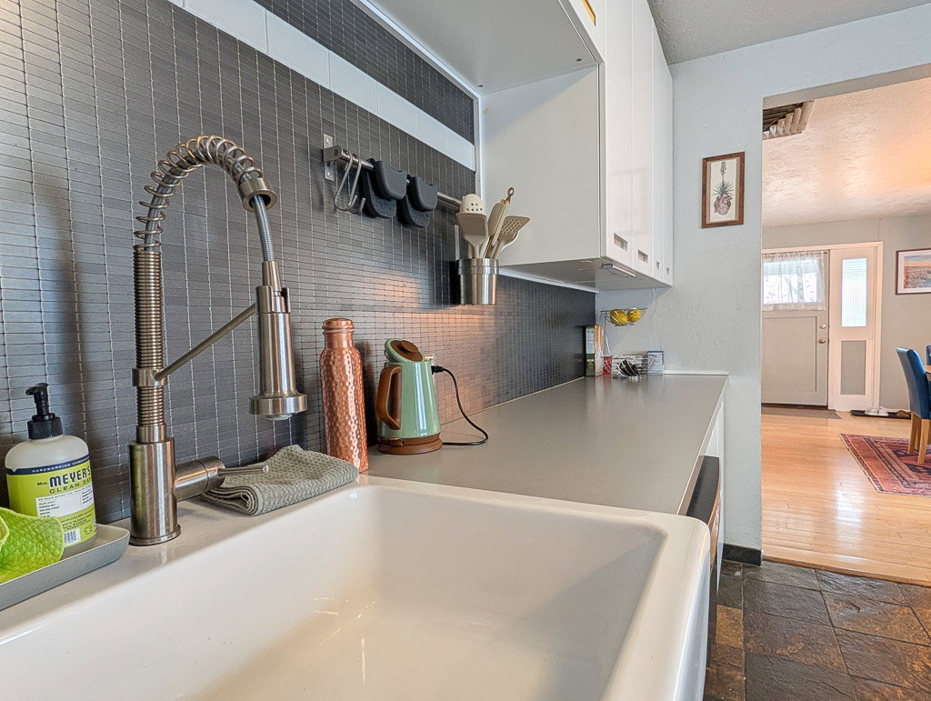 Farmhouse-style sink with a commercial-grade pull-down faucet