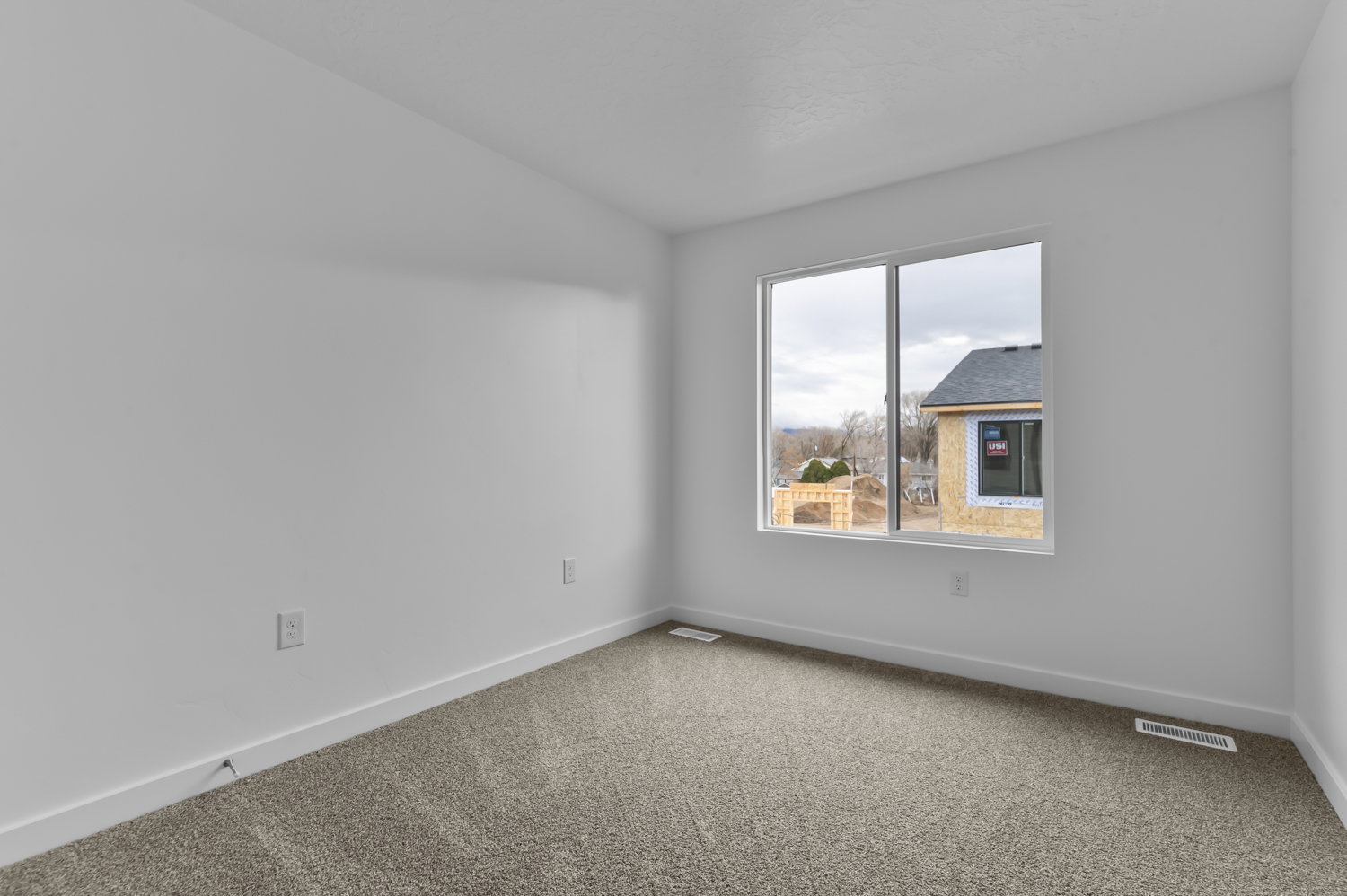 Neutral-toned carpeting paired with white walls