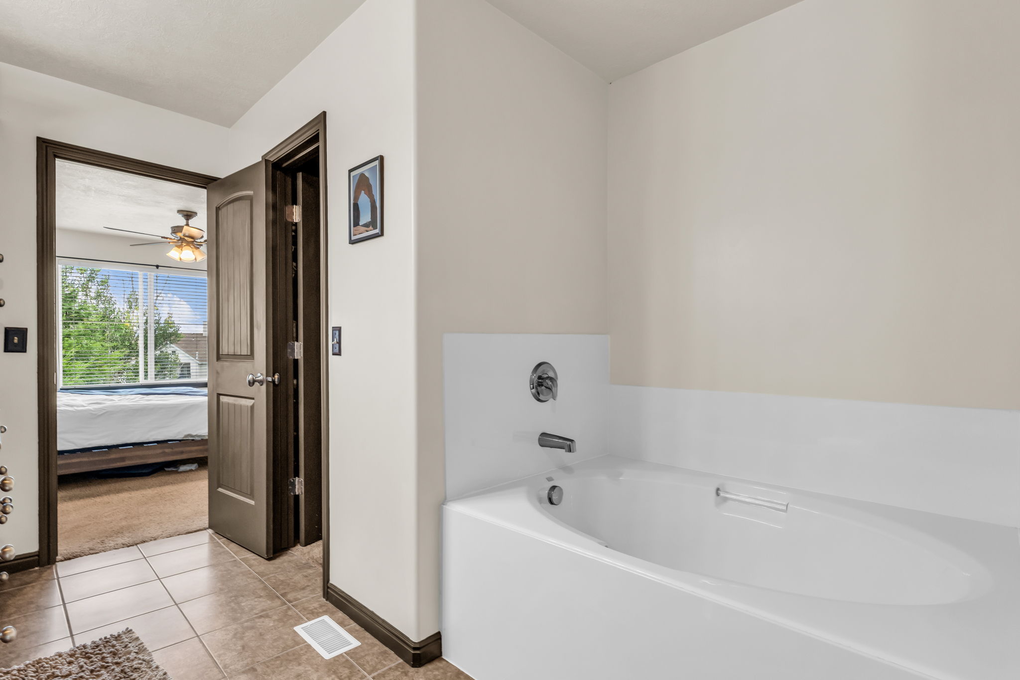 Built-in soaking tub with chrome fixtures