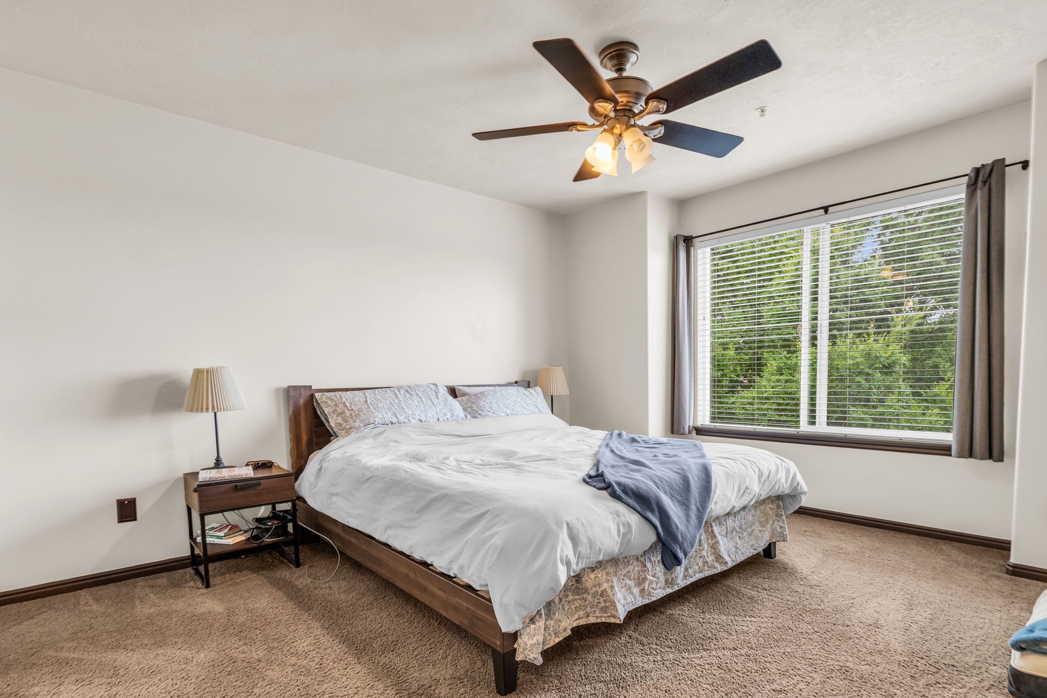 Room featuring light beige walls and brown carpet