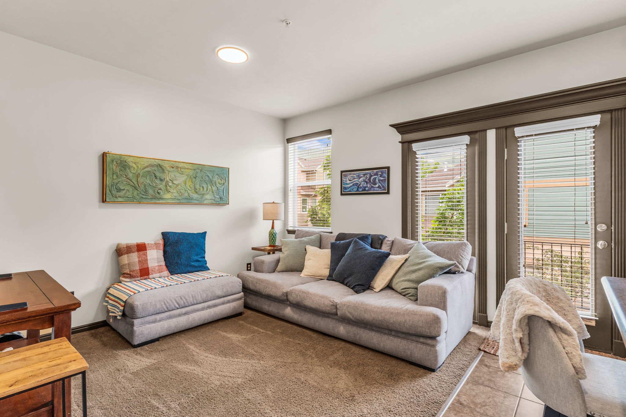 Living area featuring carpeted flooring and white walls