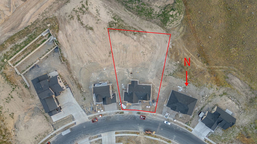 Expansive undeveloped lot featuring defined boundaries and direct road access