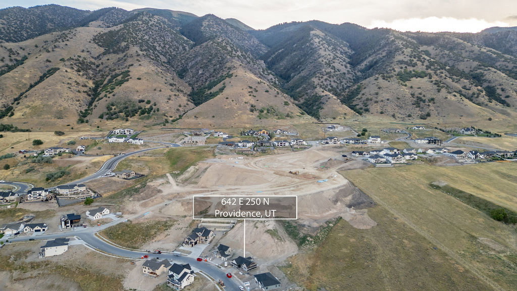 Mountainous landscape featuring developing residential areas with new construction